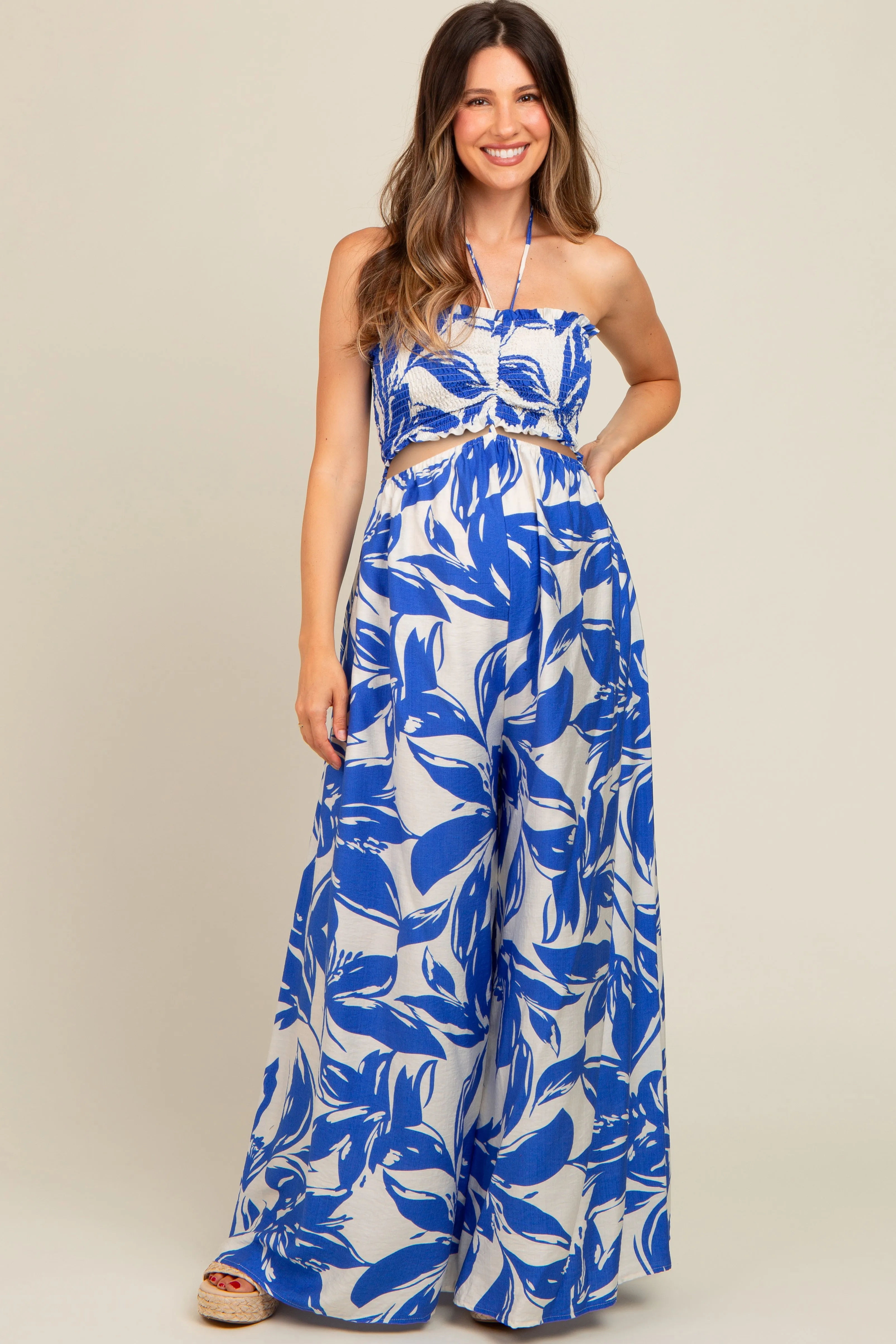 Royal Blue Tropical Print Cutout Smocked Maternity Jumpsuit sold by Pinkblush