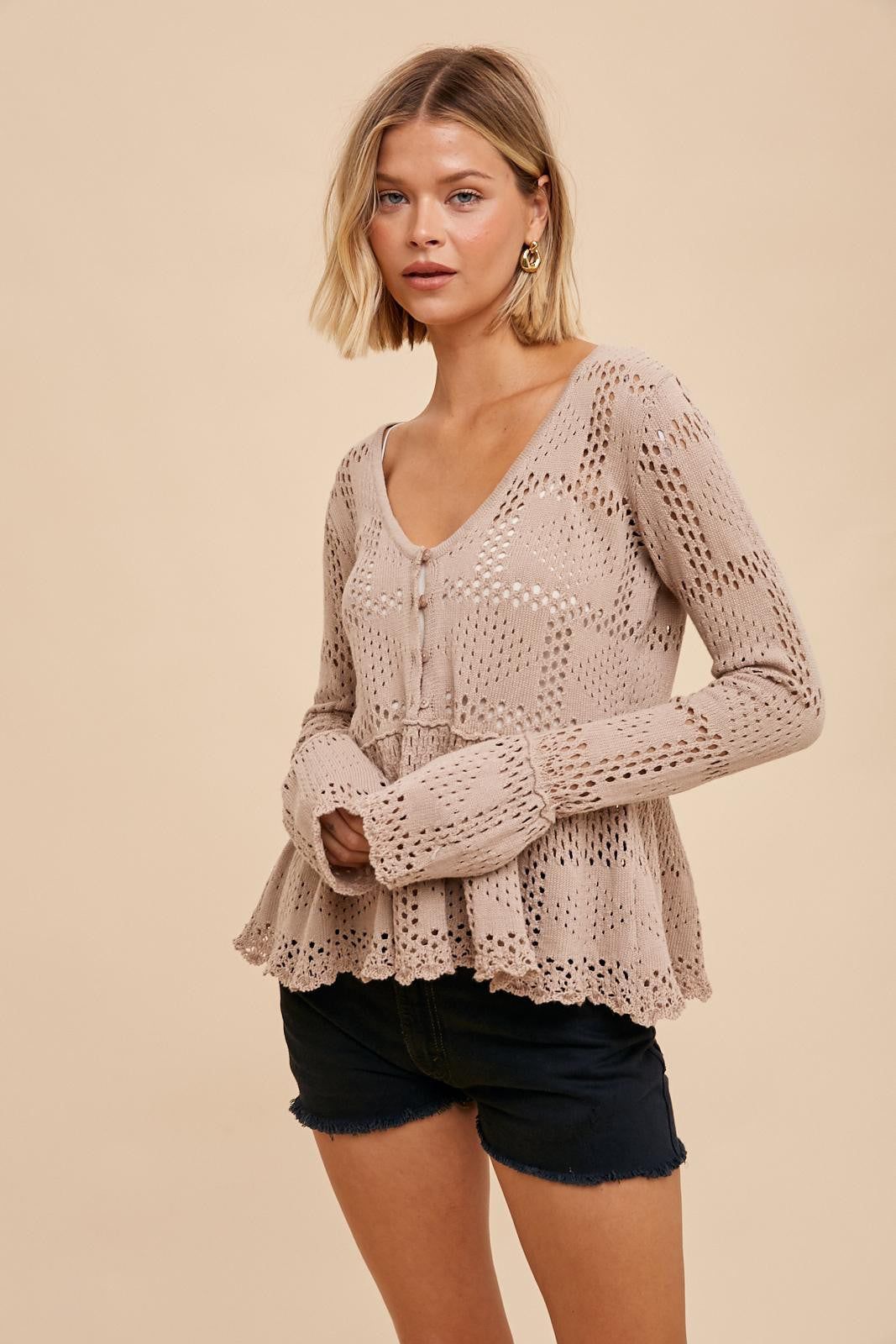 Almond Pointelle Knit Peplum Sweater sold by Pinkblush