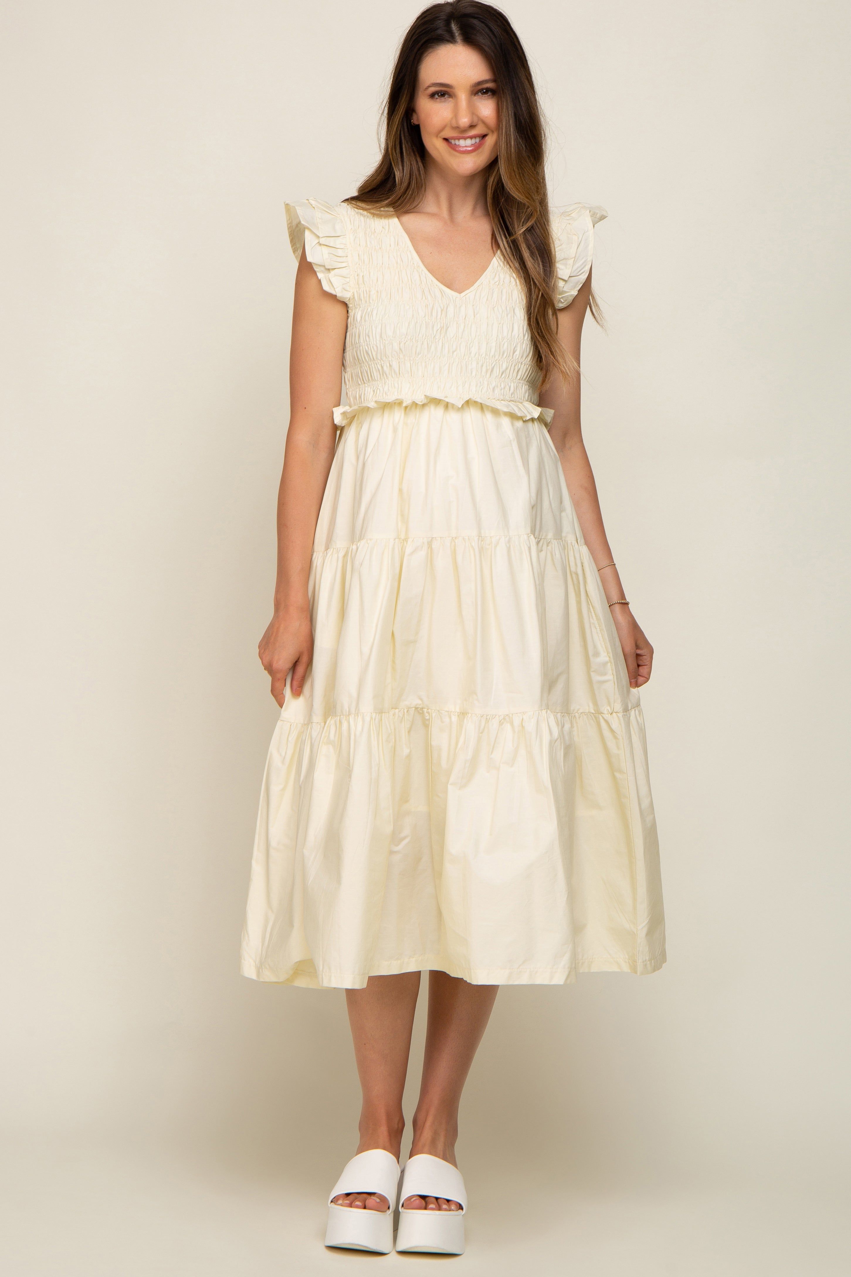Cream Smocked Flutter Sleeve Tiered Maternity Midi Dress sold by Pinkblush