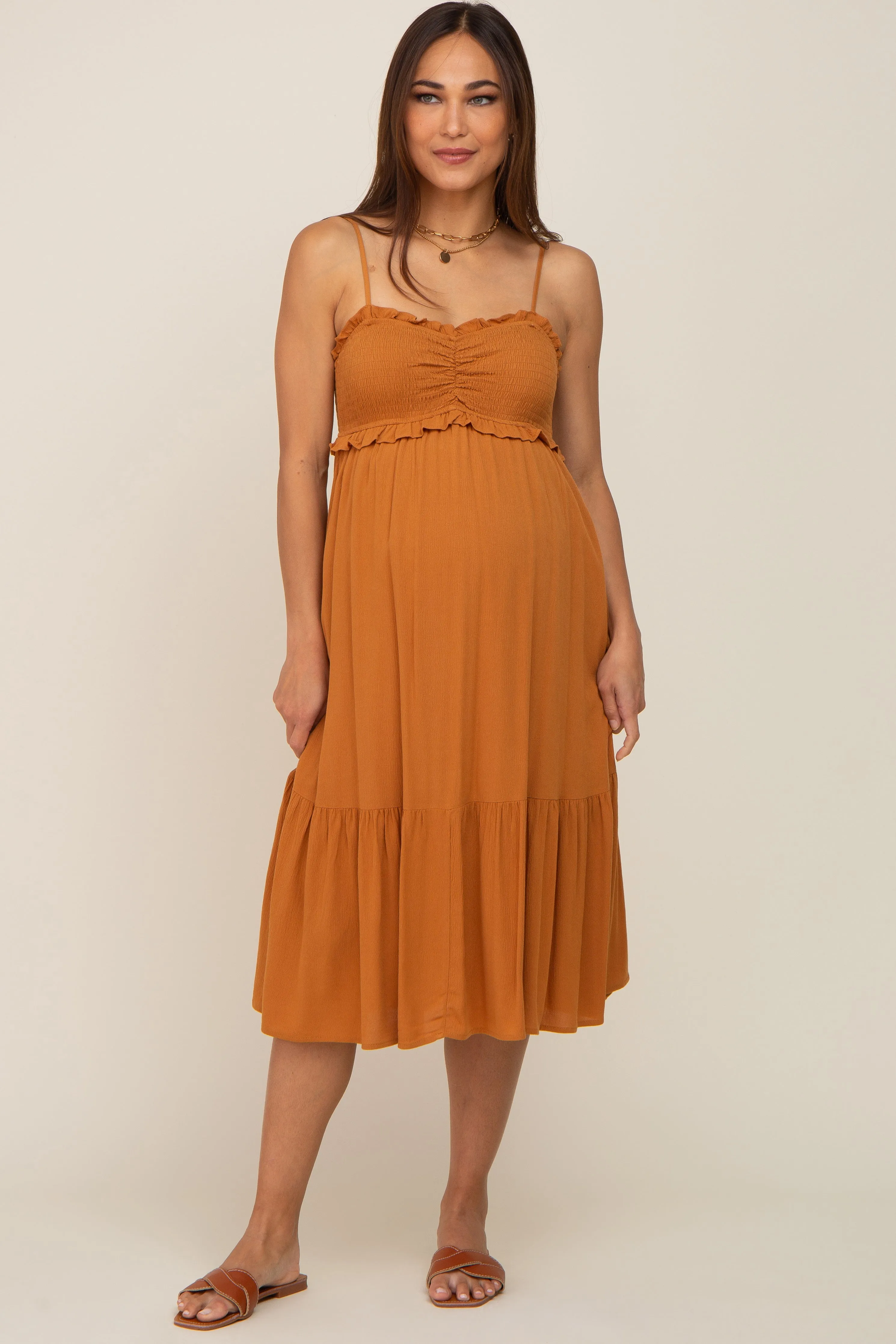 Camel Smocked Ruffle Accent Maternity Midi Dress sold by Pinkblush