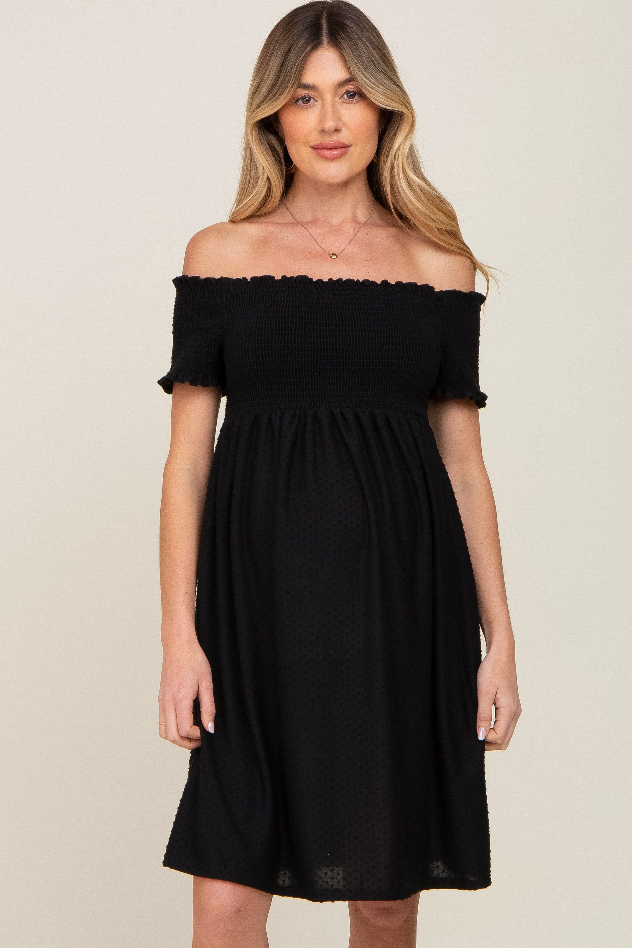 Black Swiss Dot Off Shoulder Maternity Dress sold by Pinkblush