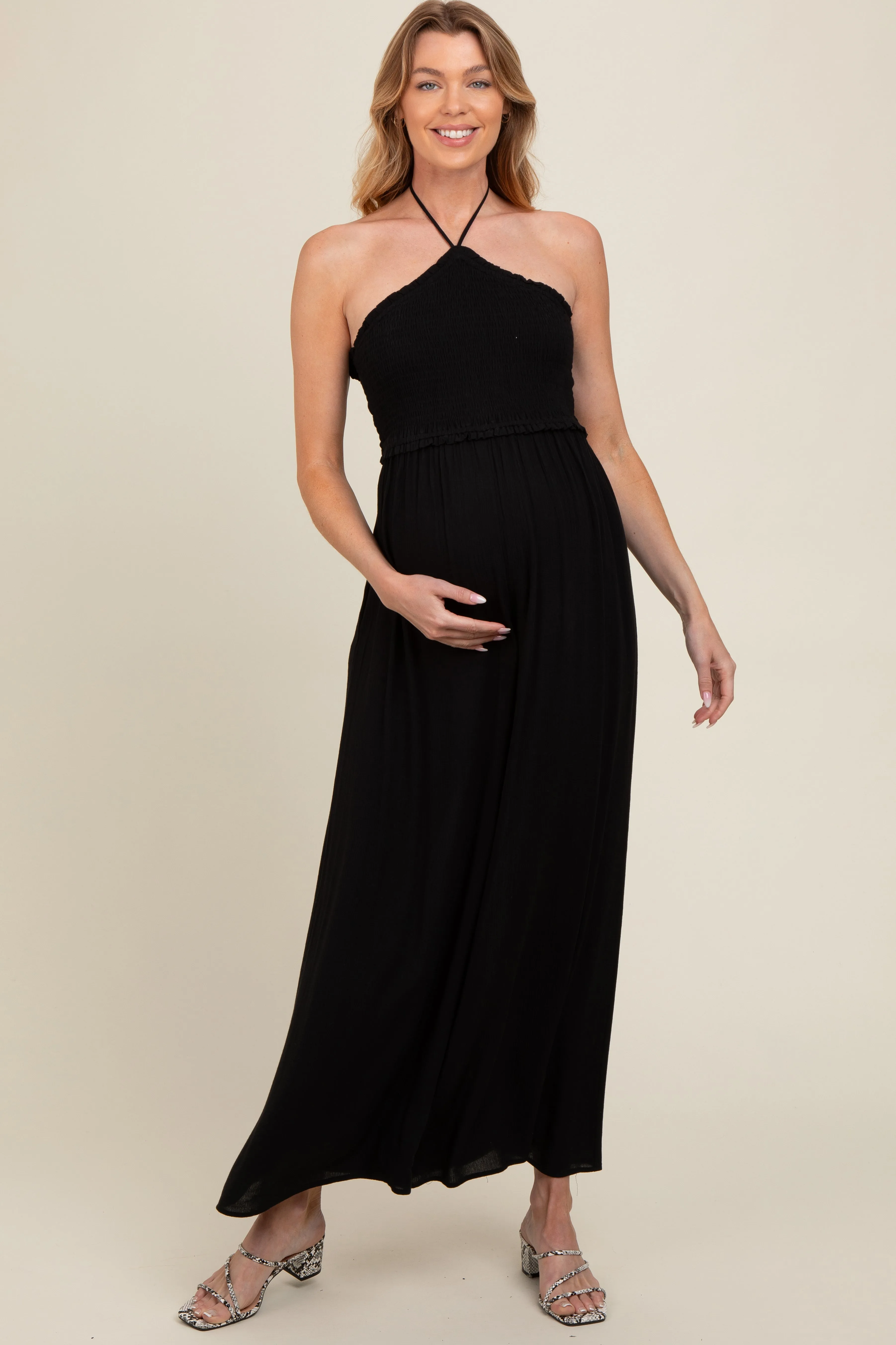 Black Back Cutout Smocked Halter Wide Leg Maternity Jumpsuit sold by Pinkblush