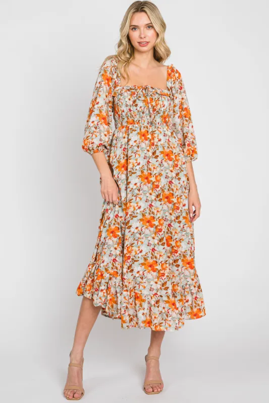 Light Blue Floral Ruffle Square Neck Smocked Front Tie Midi Dress sold by Pinkblush