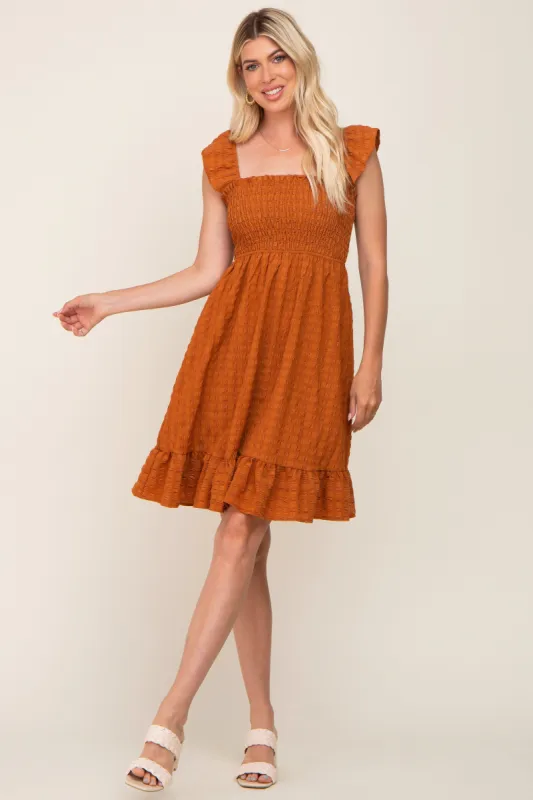 Camel Textured Sleeveless Smocked Dress sold by Pinkblush