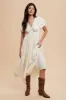 Cream Deep V-Neck Puff Short Sleeve Asymmetrical Hem Maternity Midi Dress sold by Pinkblush