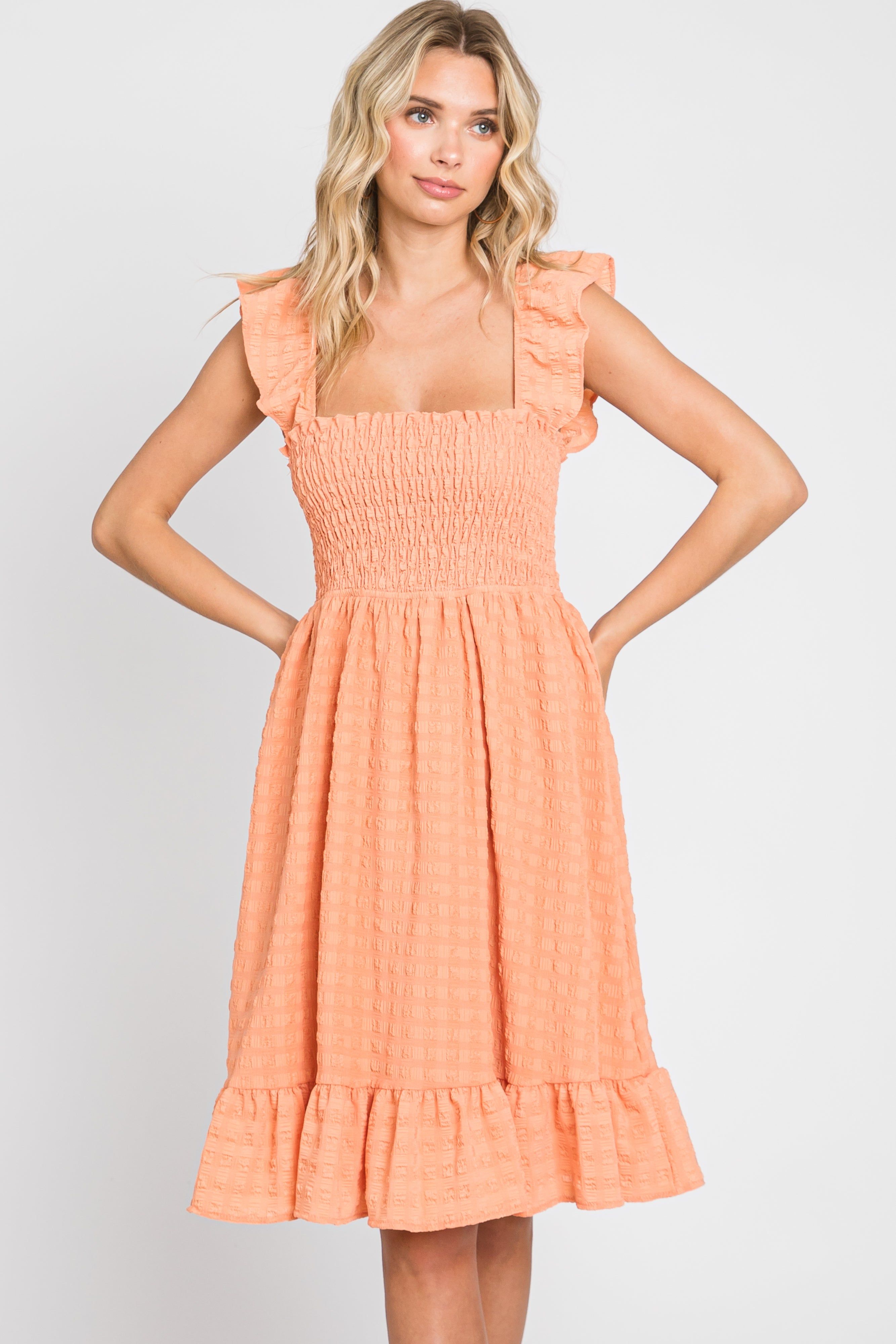 Peach Textured Sleeveless Smocked Dress sold by Pinkblush