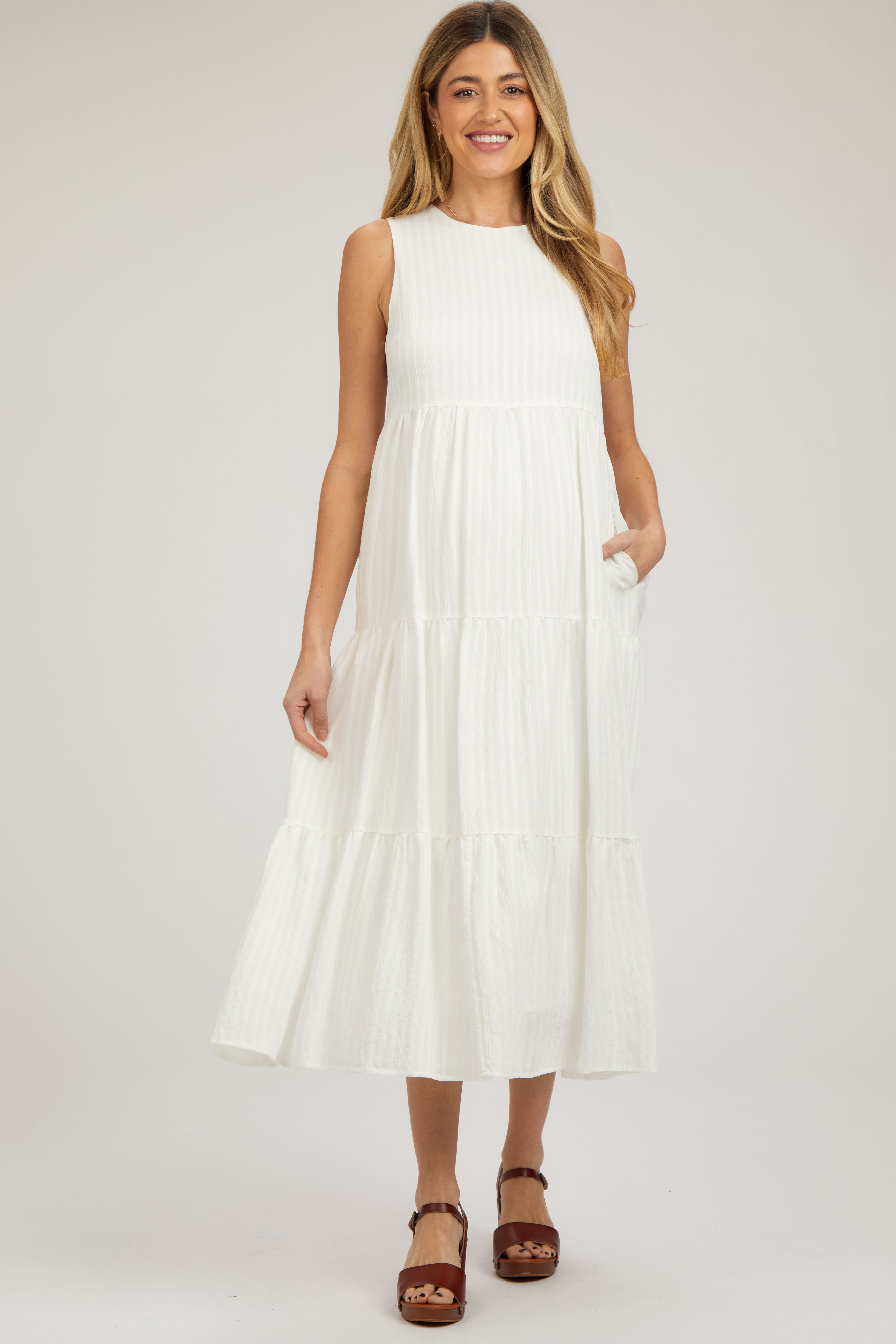 White Sleeveless Tiered Maternity Maxi Dress sold by Pinkblush