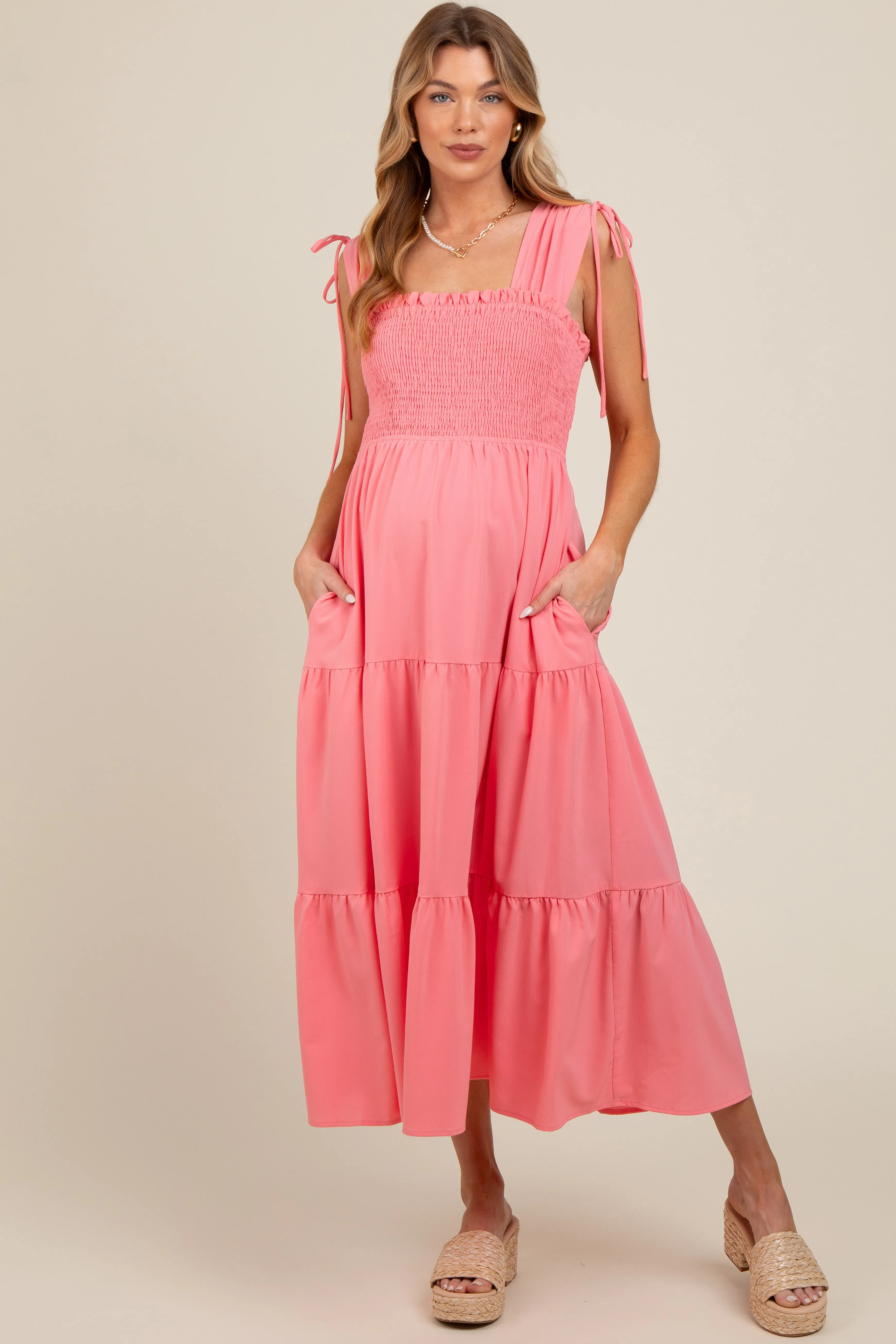 Coral Smocked Sleeveless Drawstring Shoulder Tiered Maternity Midi Dress sold by Pinkblush