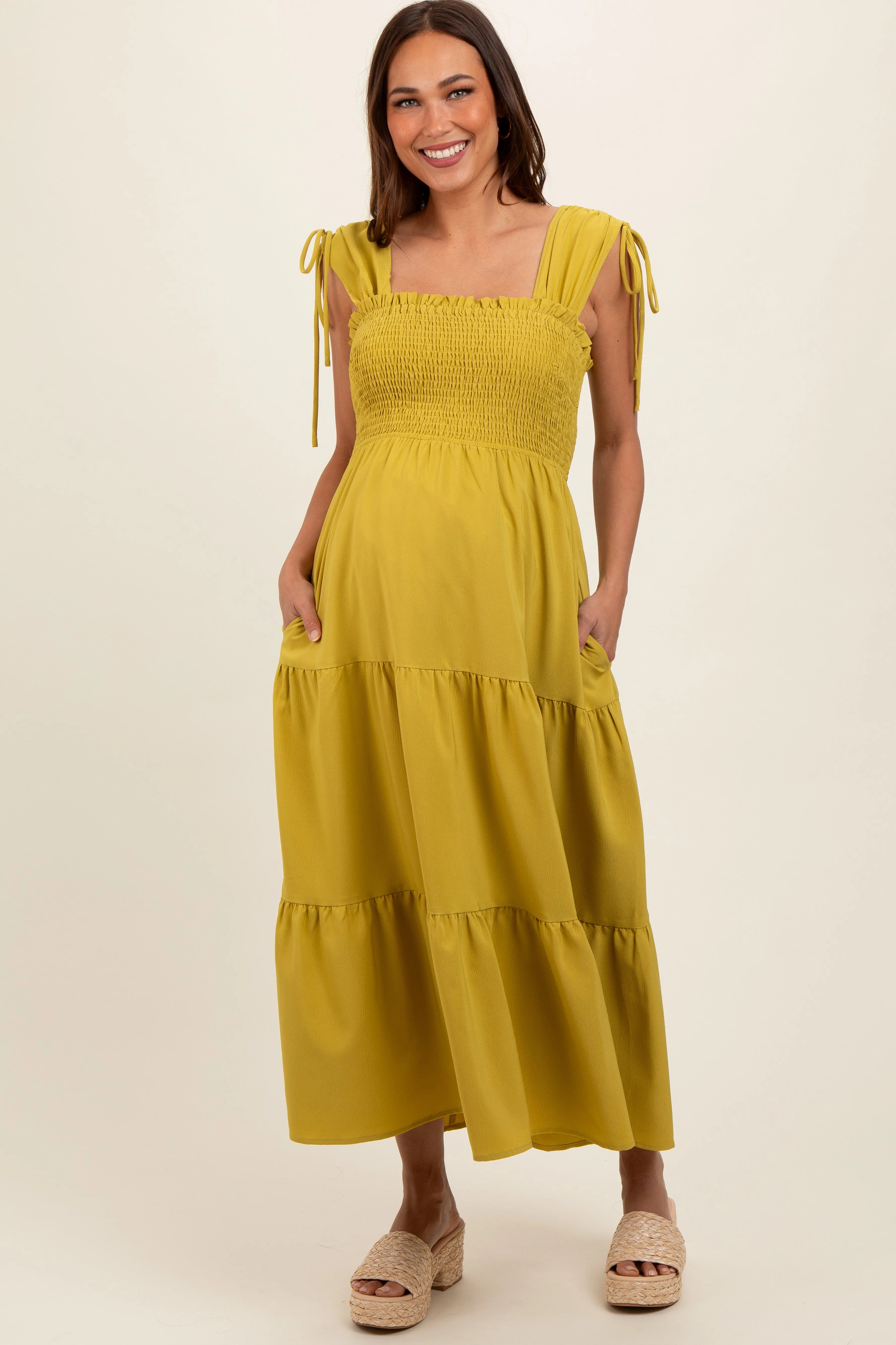 Light Olive Smocked Sleeveless Drawstring Shoulder Tiered Maternity Midi Dress sold by Pinkblush