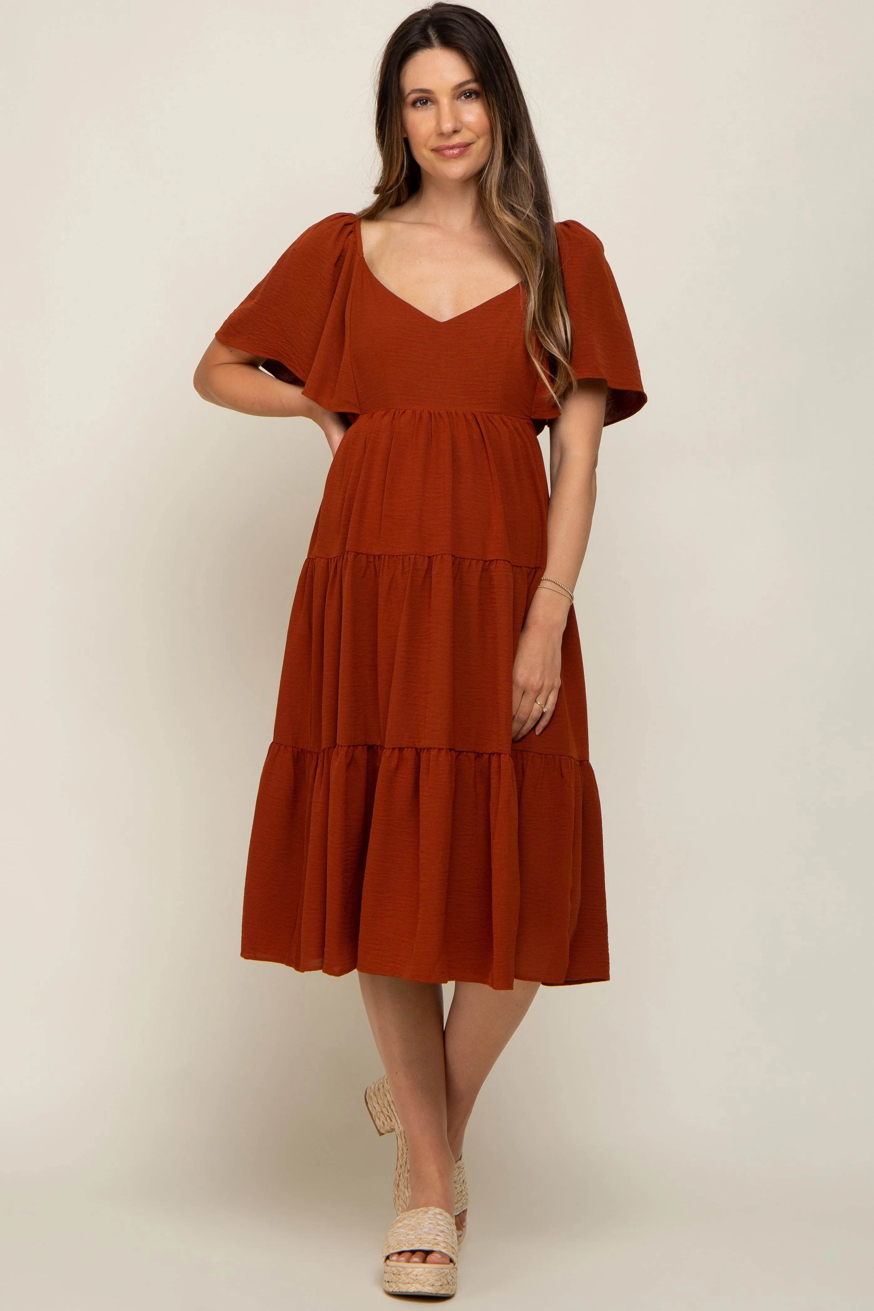 Rust Tiered Criss Cross Back Maternity Midi Dress sold by Pinkblush