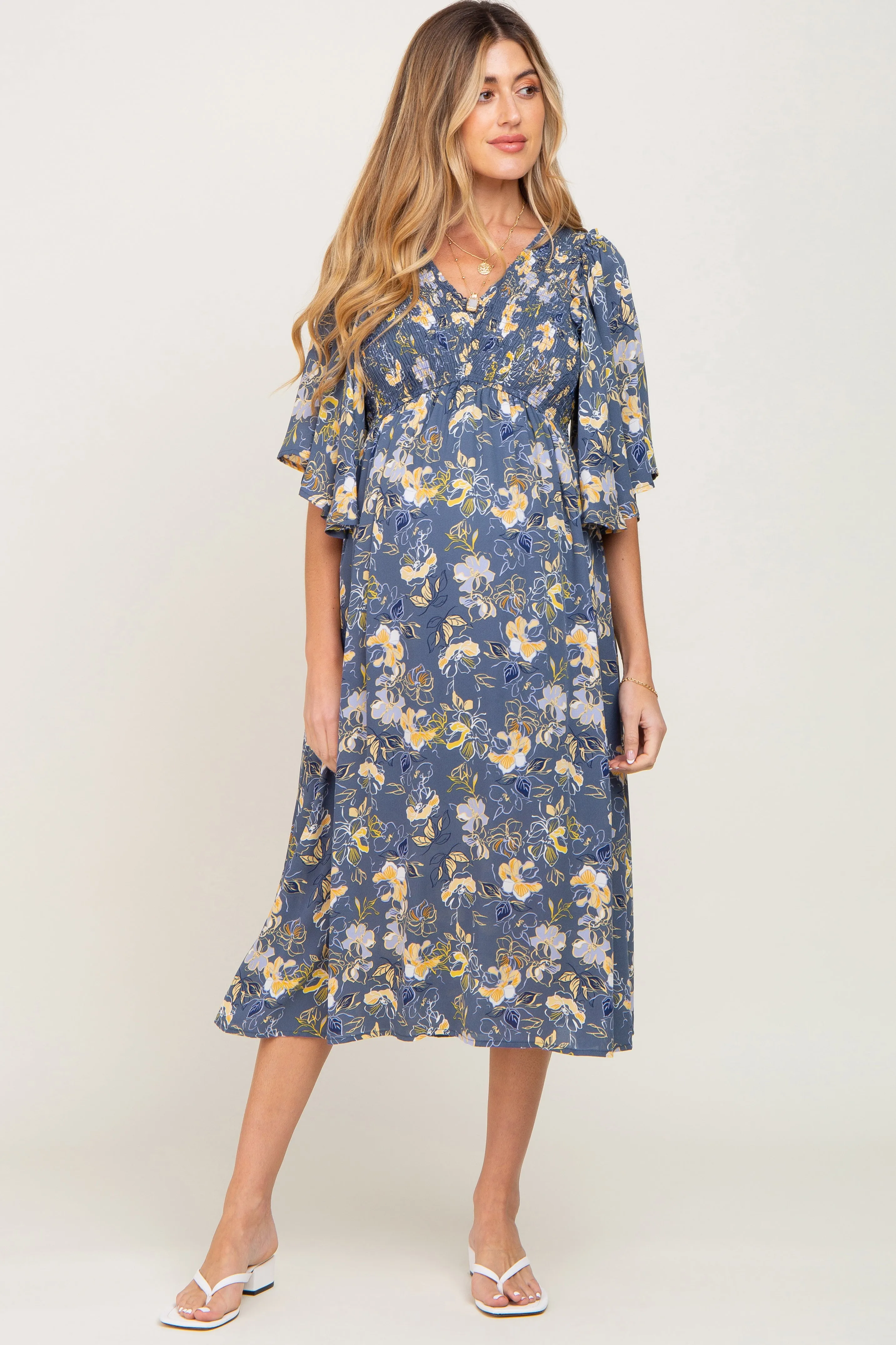 Blue Floral Smocked Flowy Half Sleeve Maternity Midi Dress sold by Pinkblush