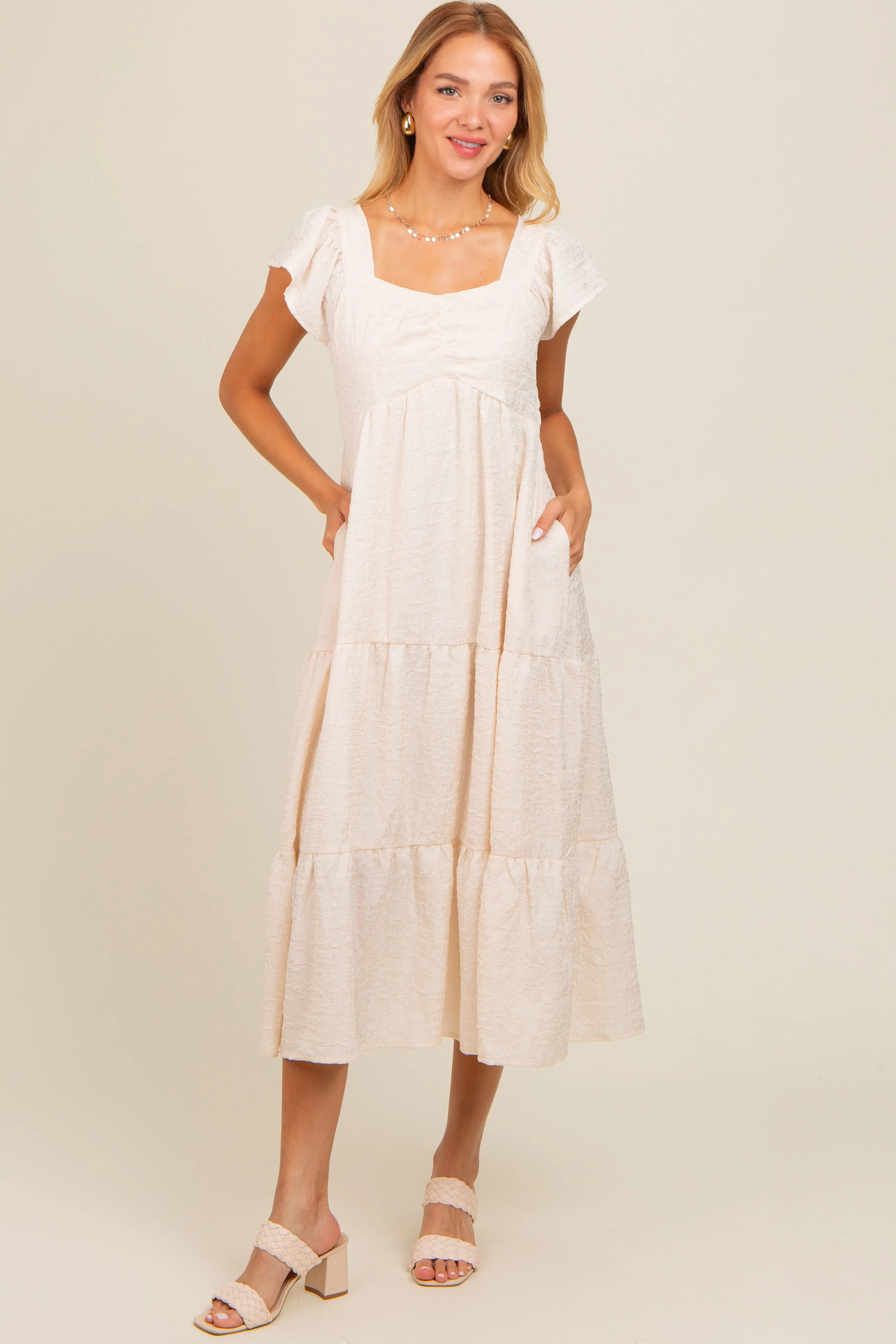 Ivory Textured Sweetheart Neck Short Puff Sleeve Tiered Midi Dress sold by Pinkblush