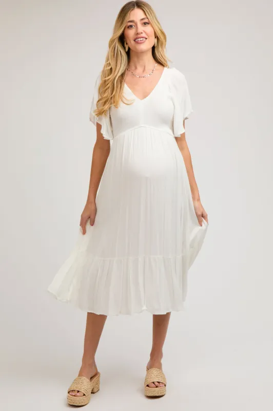 Ivory Smocked Ruffle Maternity Dress sold by Pinkblush