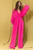 Fuchsia Solid Smocked Ruffled V-Neck Jumpsuit sold by Pinkblush