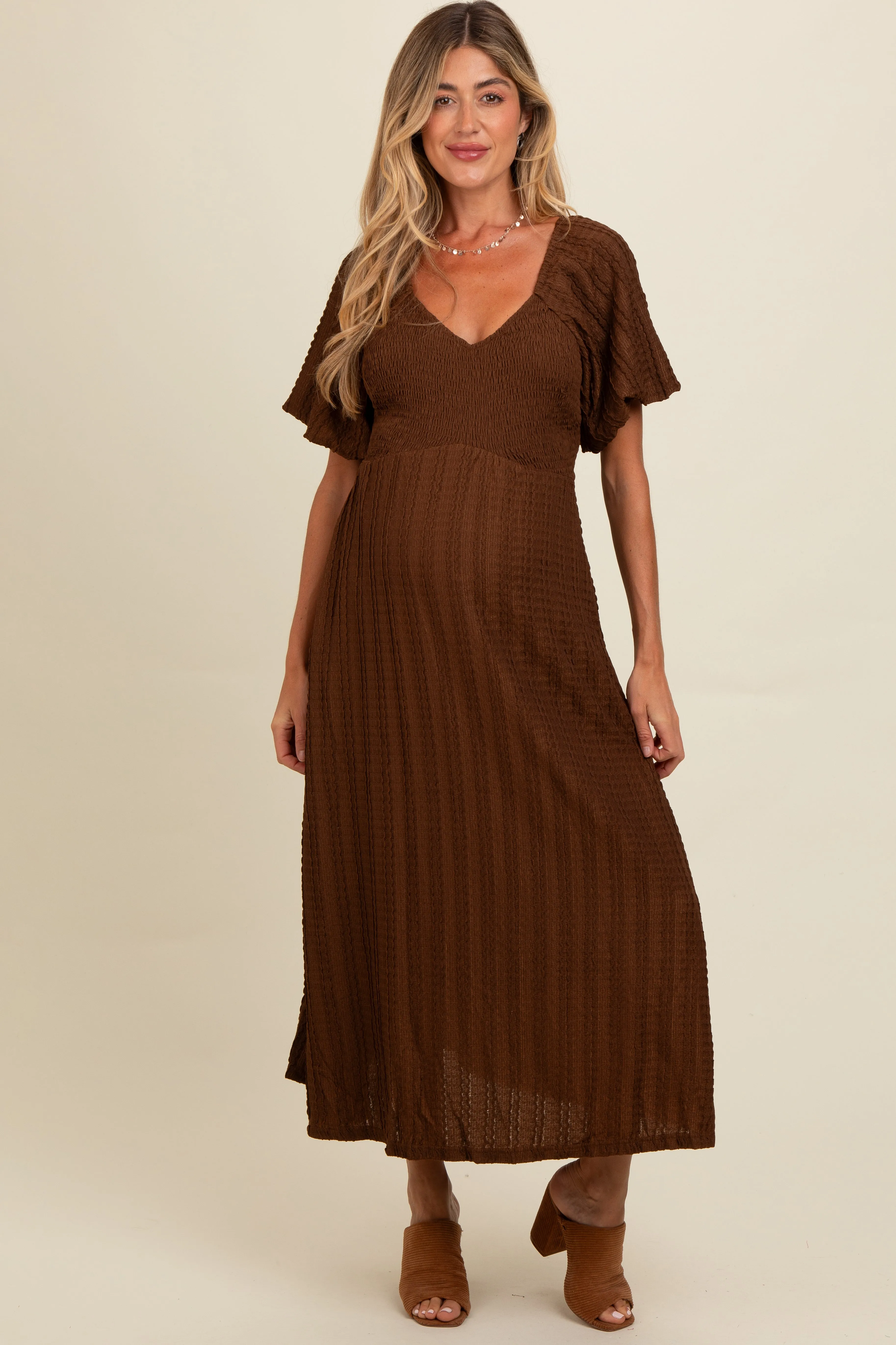 Brown Smocked V-Neck Short Puff Sleeve Textured Maternity Midi Dress sold by Pinkblush