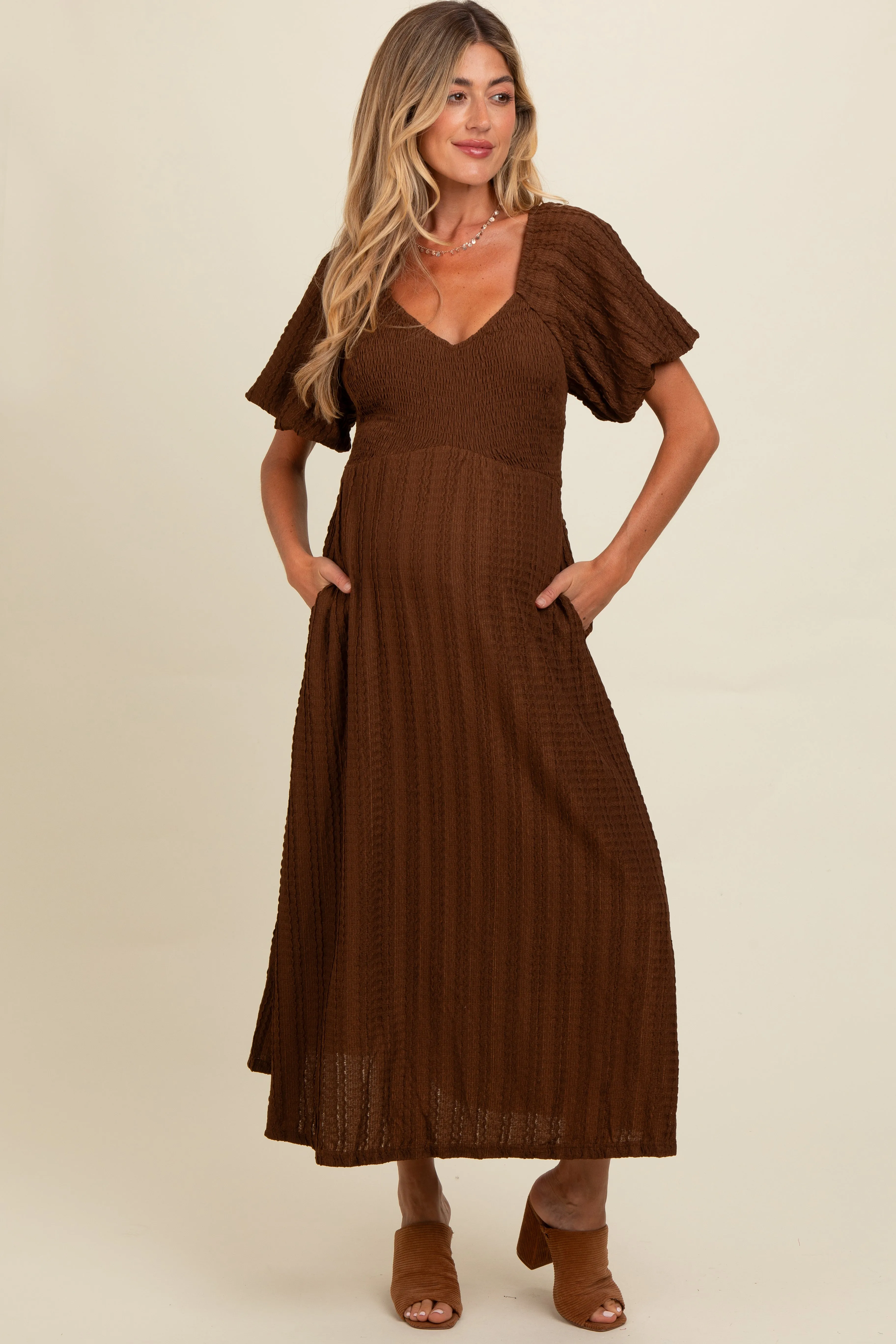 Brown Smocked V-Neck Short Puff Sleeve Textured Maternity Midi Dress sold by Pinkblush product image thumbnail 2