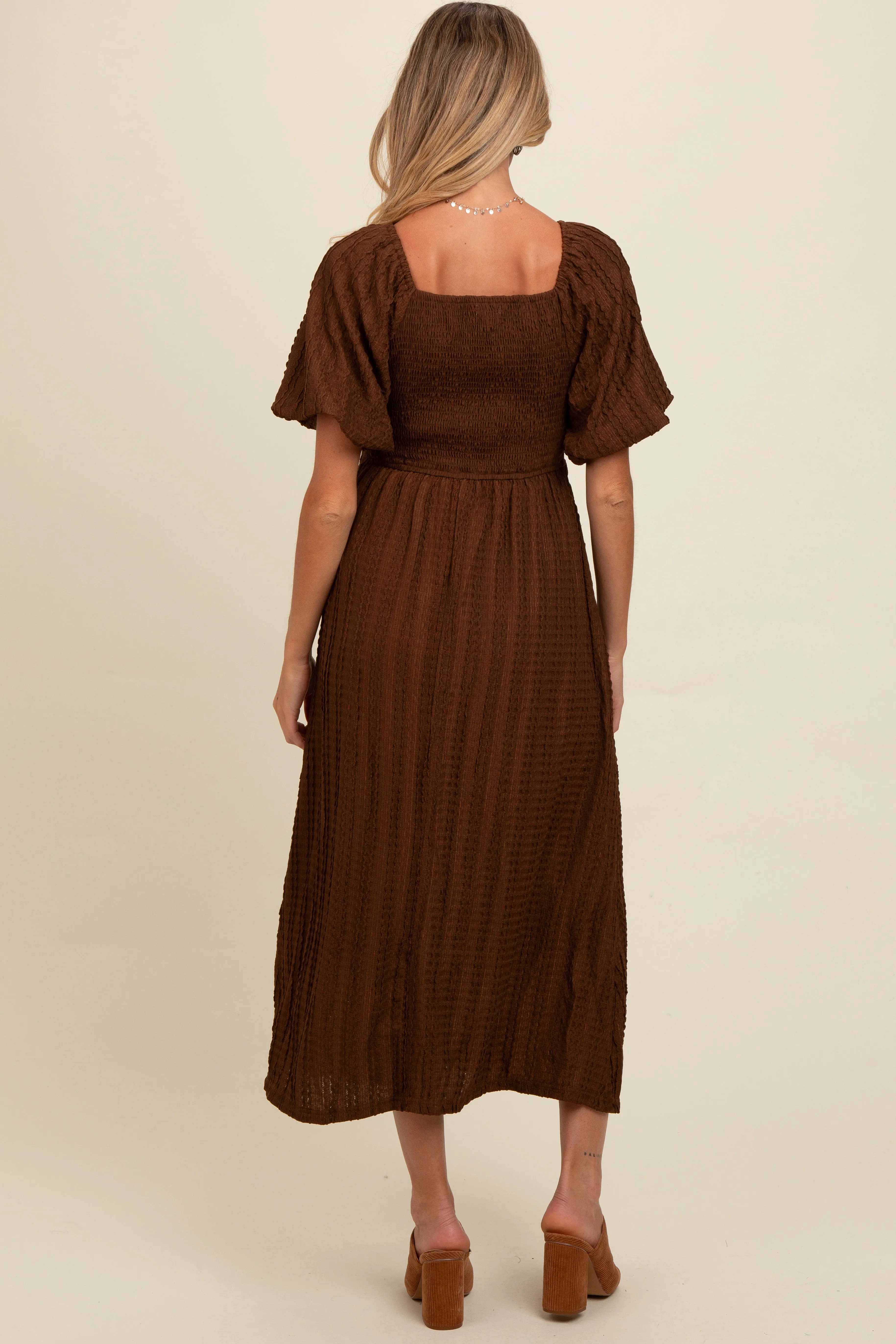 Brown Smocked V-Neck Short Puff Sleeve Textured Maternity Midi Dress sold by Pinkblush product image thumbnail 3