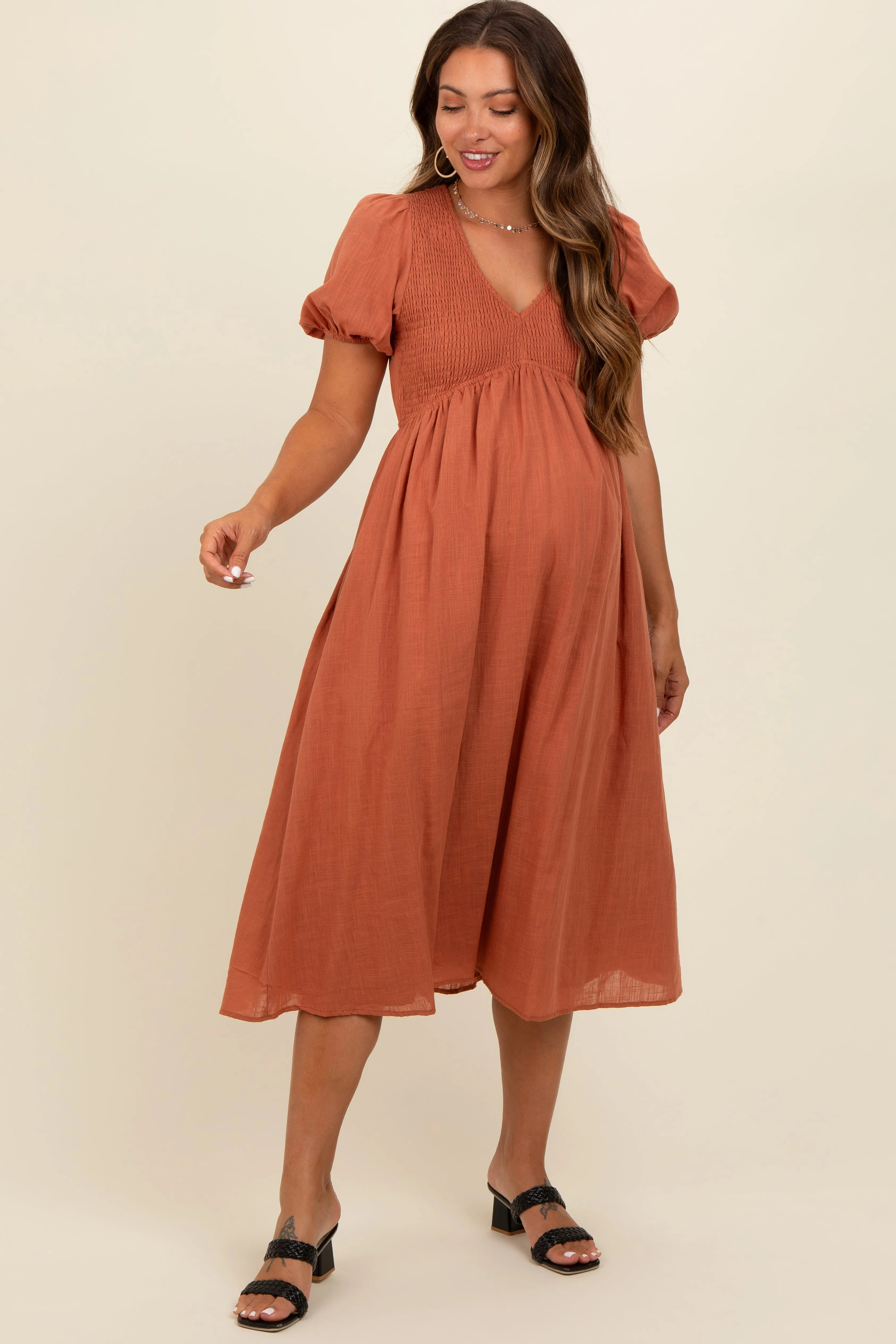 Rust Smocked V-Neck Puff Sleeve Maternity Midi Dress sold by Pinkblush