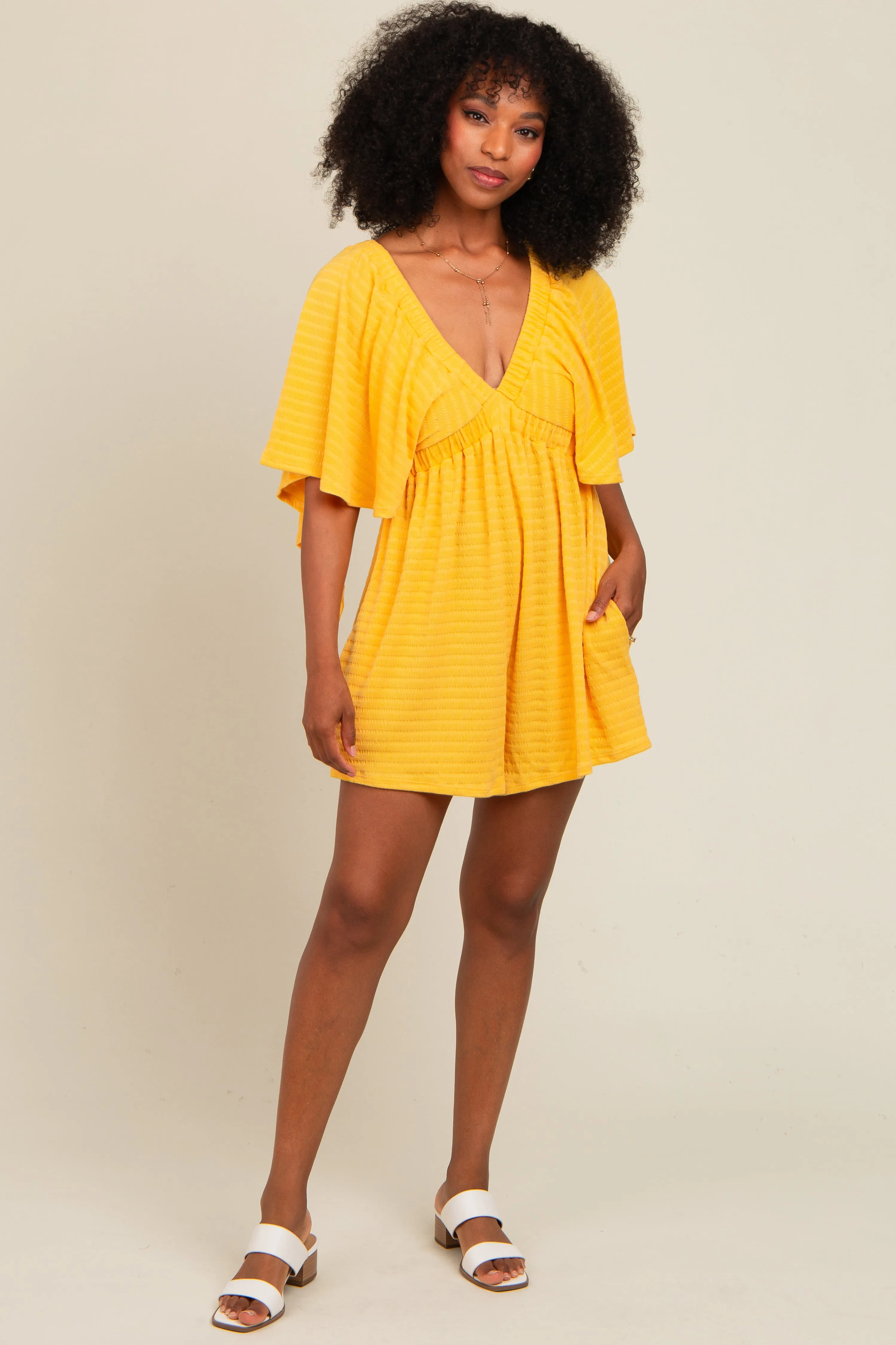 Yellow Textured Open Back Romper sold by Pinkblush