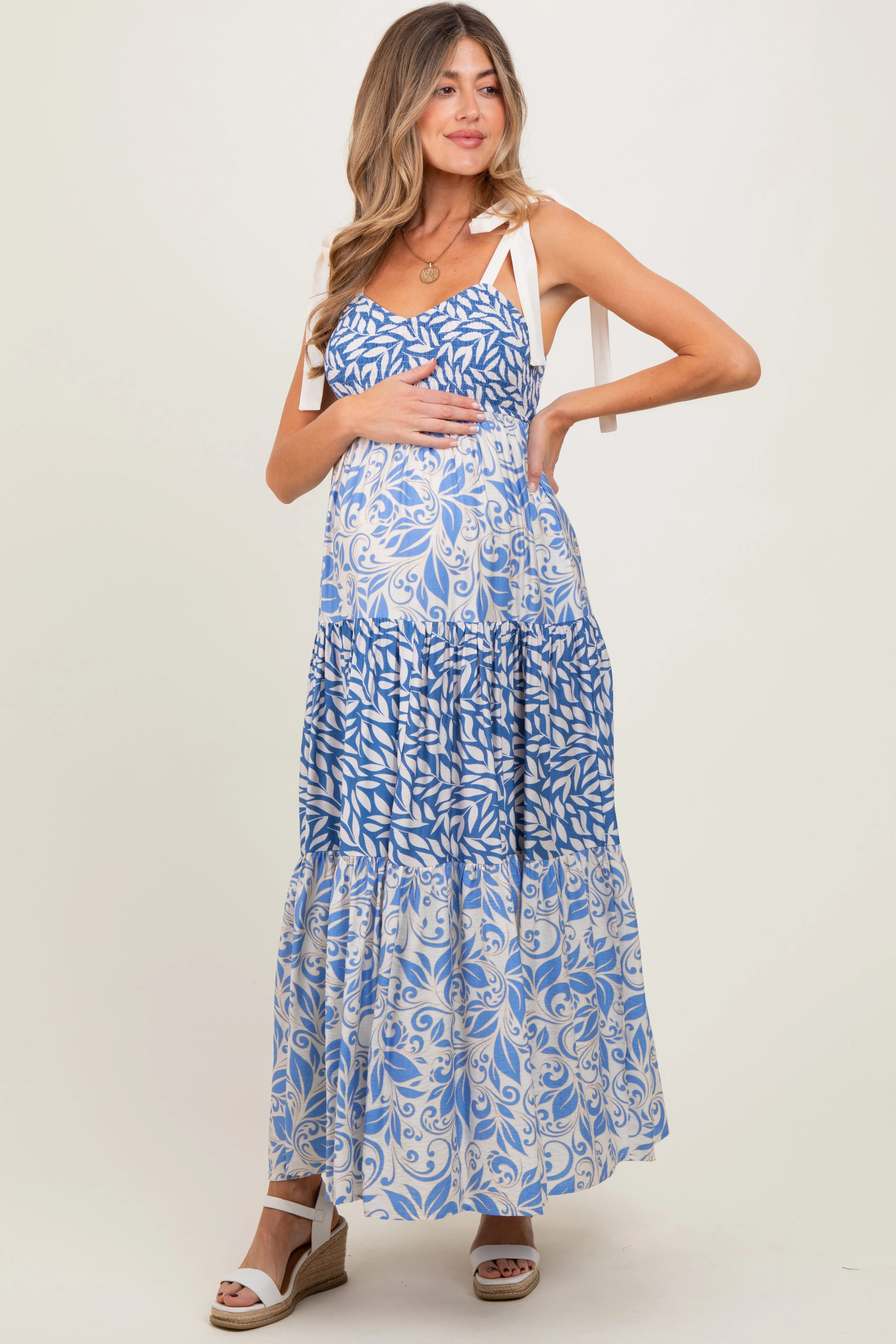 Blue Leaf Print Smocked Shoulder Tie Tiered Maternity Maxi Dress sold by Pinkblush product image thumbnail 2