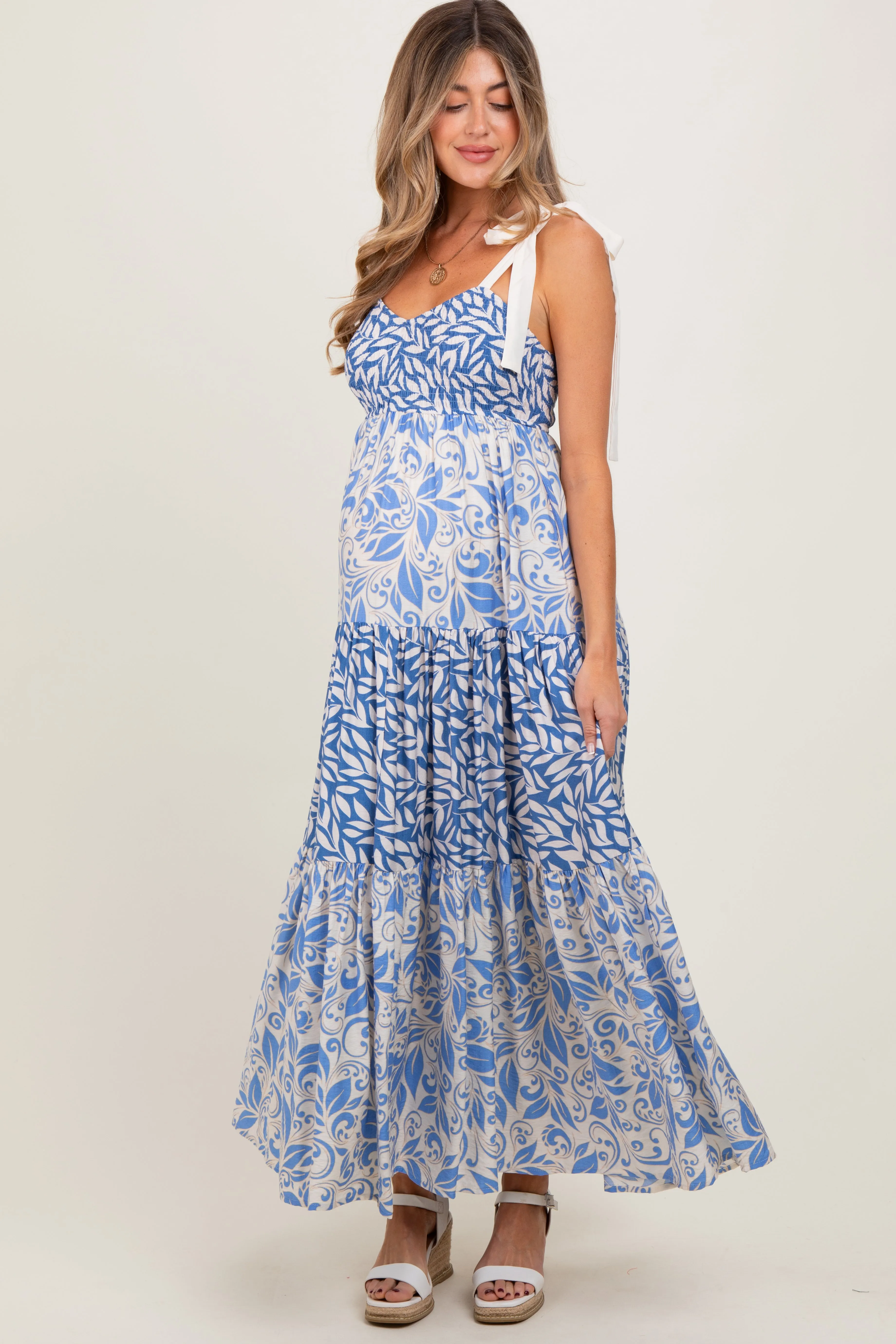 Blue Leaf Print Smocked Shoulder Tie Tiered Maternity Maxi Dress sold by Pinkblush