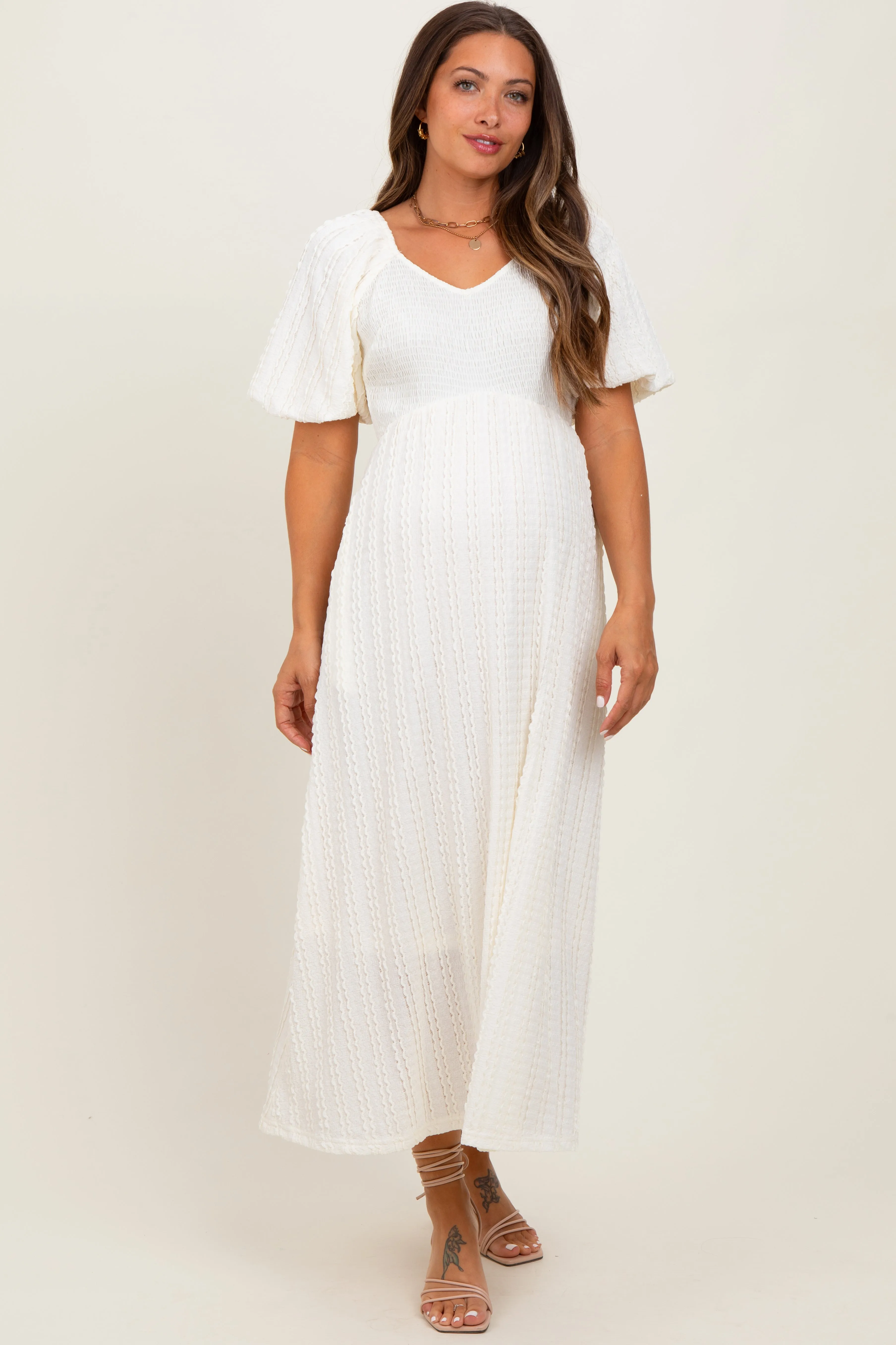 Cream Smocked V-Neck Short Puff Sleeve Textured Maternity Midi Dress sold by Pinkblush
