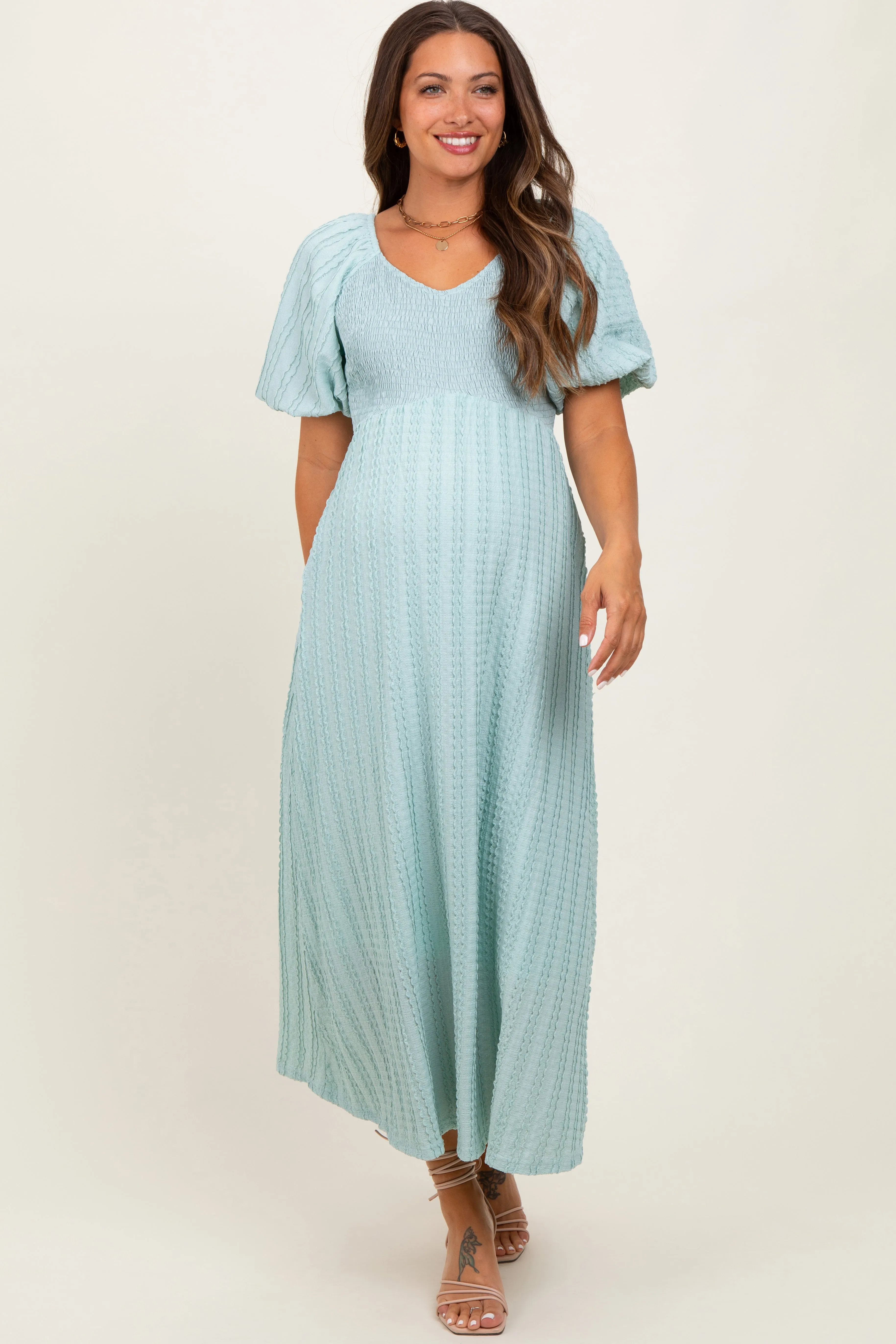 Mint Green Smocked V-Neck Short Puff Sleeve Textured Maternity Midi Dress sold by Pinkblush product image thumbnail 2