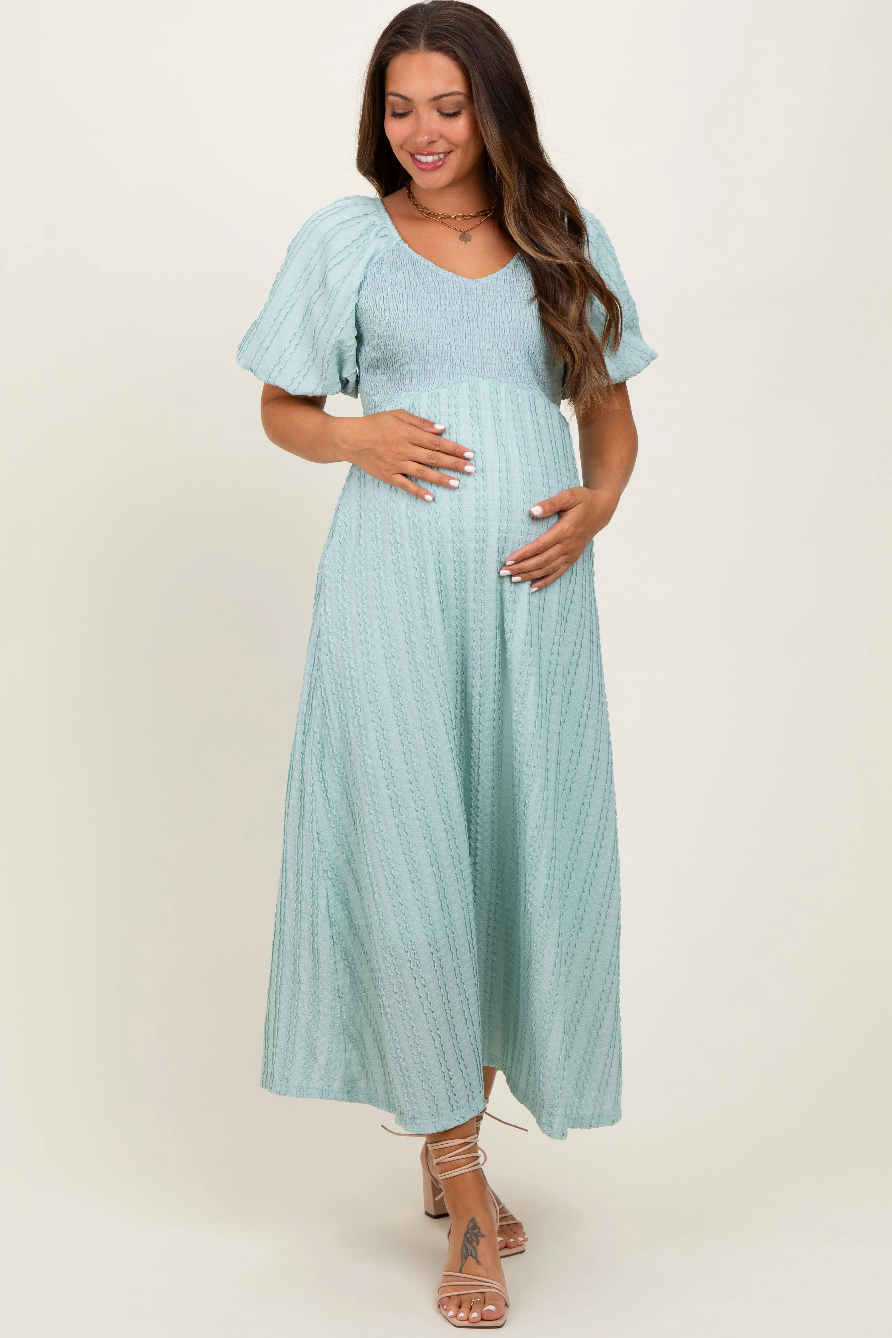 Mint Green Smocked V-Neck Short Puff Sleeve Textured Maternity Midi Dress sold by Pinkblush