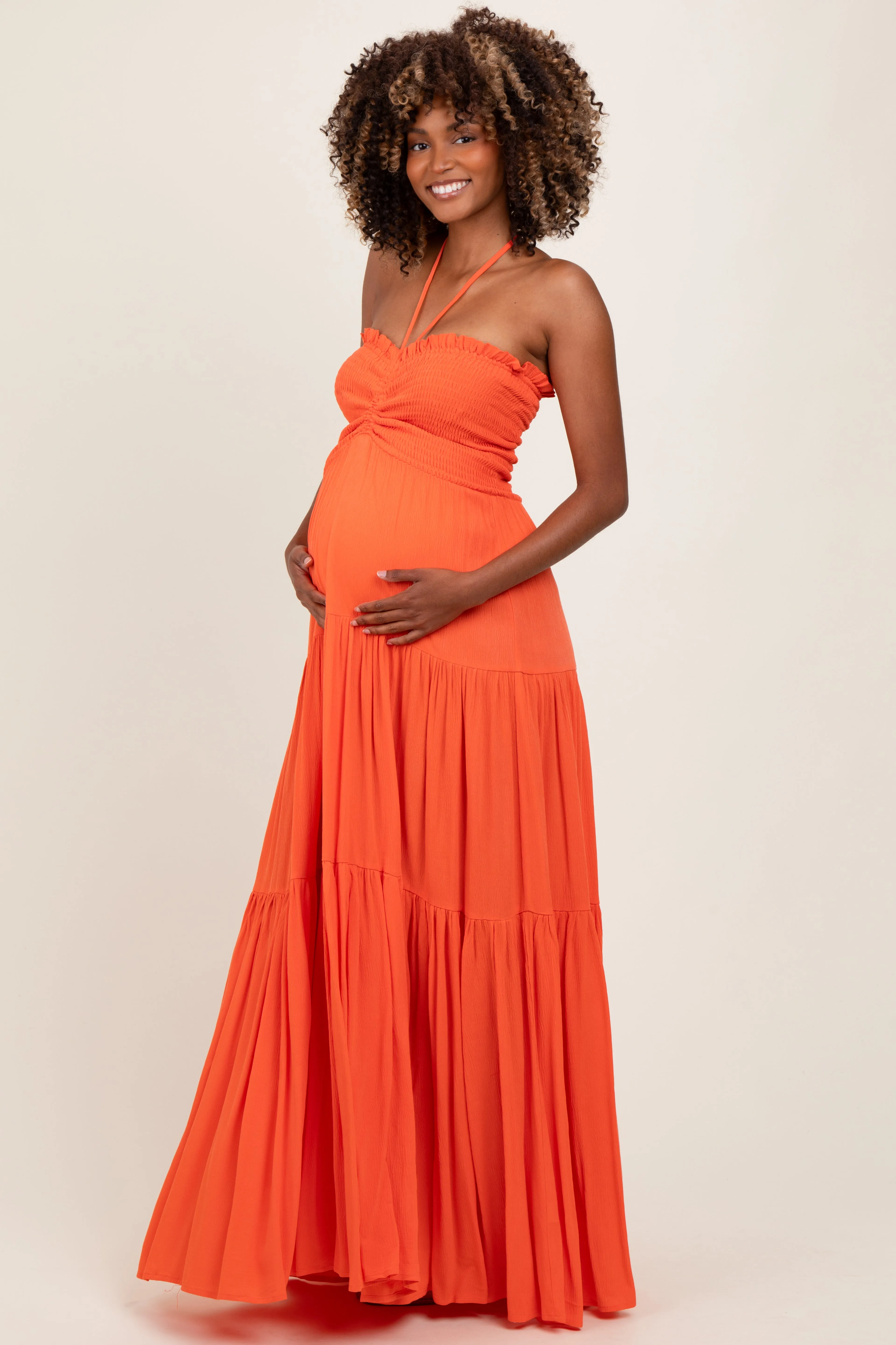 Orange Smocked Halter Tiered Maternity Maxi Dress sold by Pinkblush