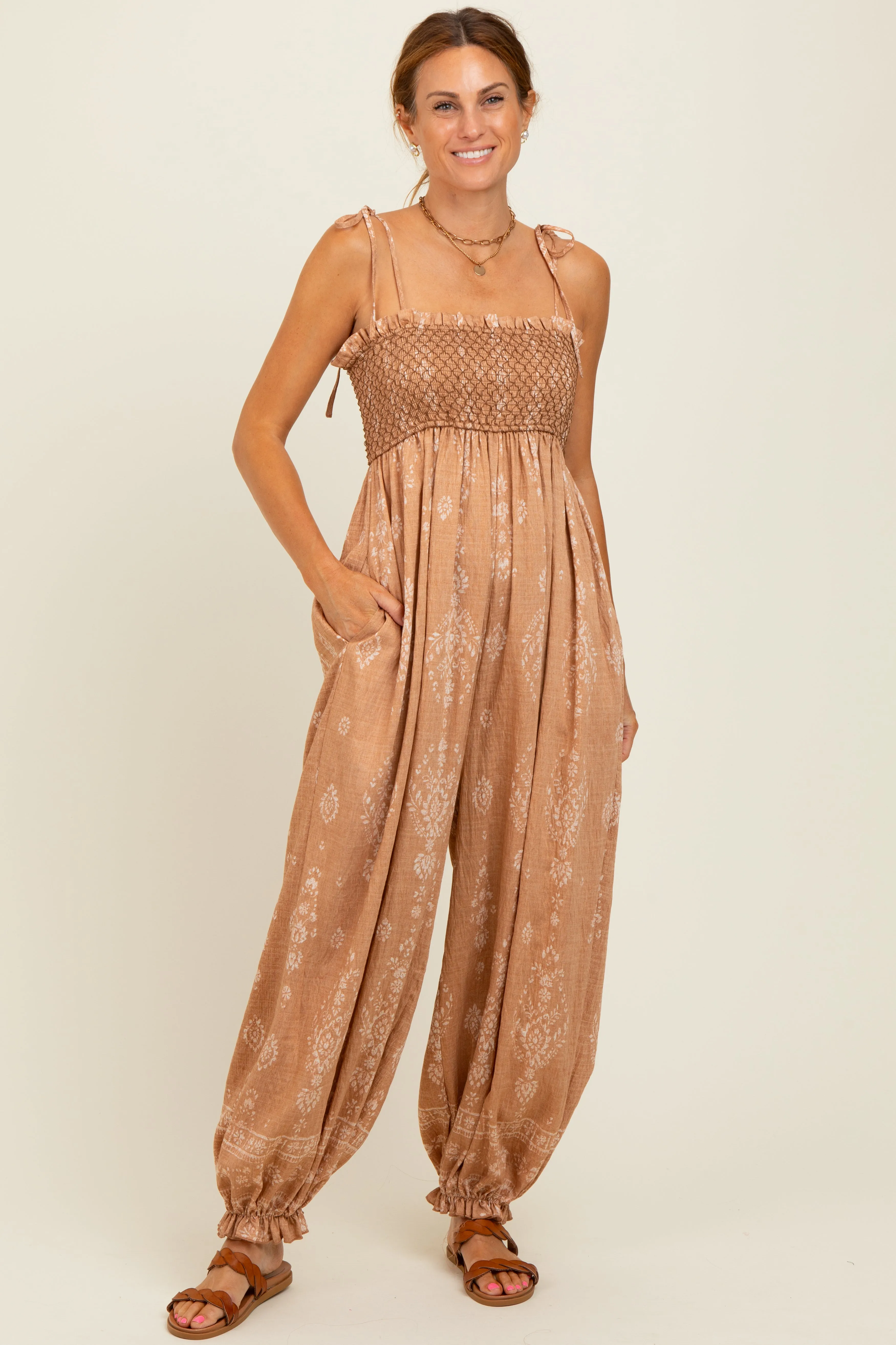 Camel Printed Smocked Shoulder Tie Jumpsuit sold by Pinkblush