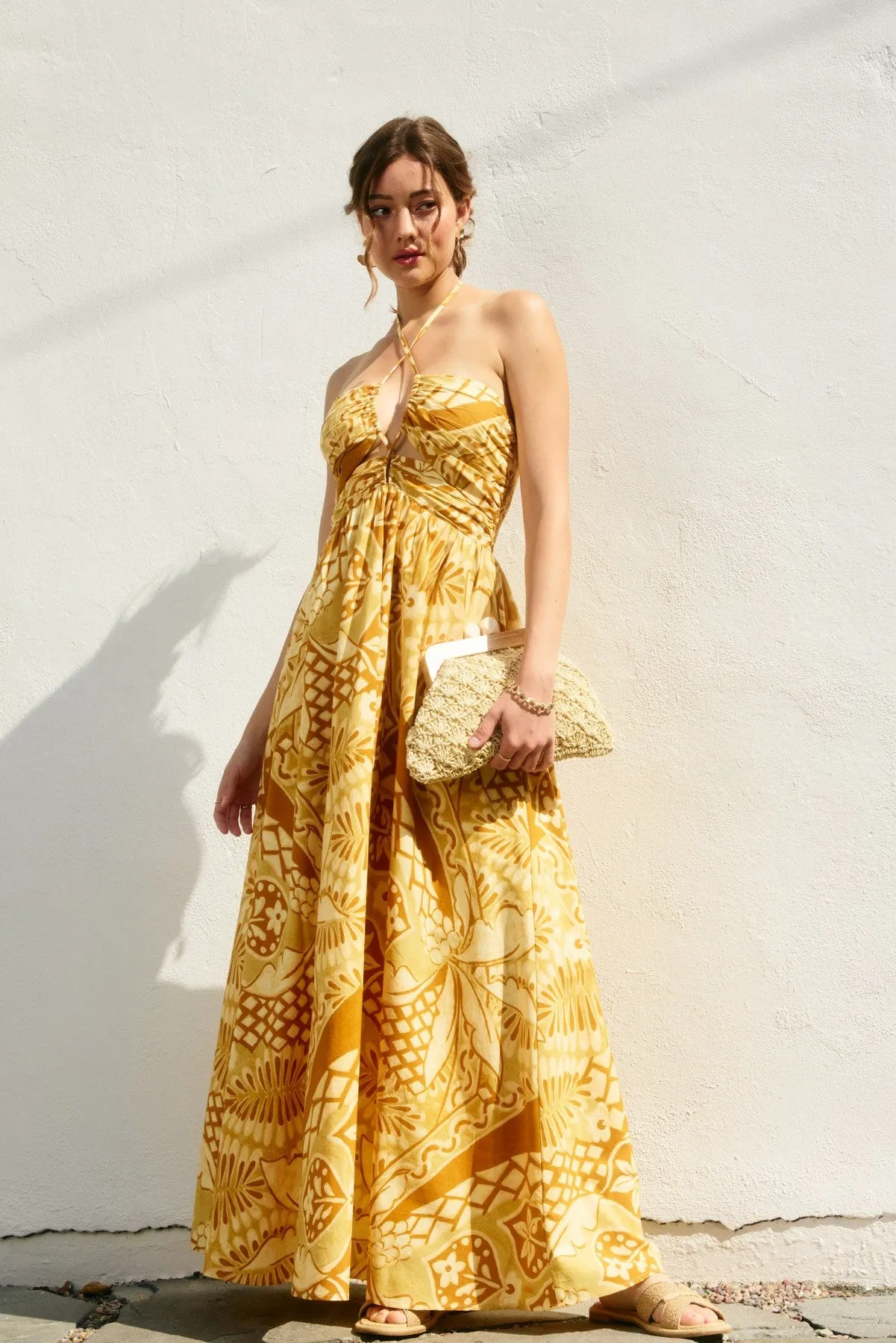 Yellow Printed Cutout Halter Maxi Dress sold by Pinkblush