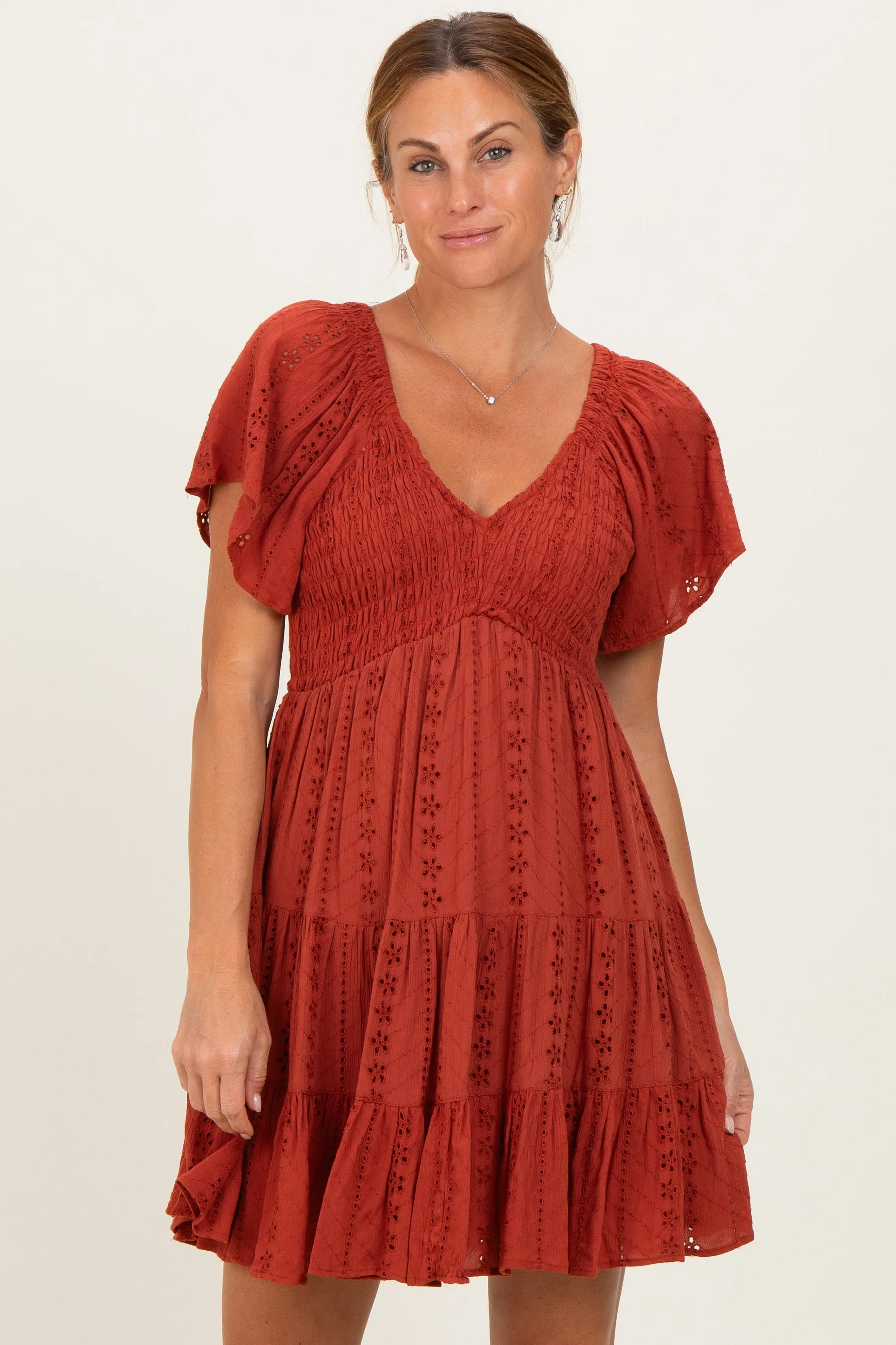 Rust Eyelet Embroidered V Neck Smocked Bodice Dress sold by Pinkblush