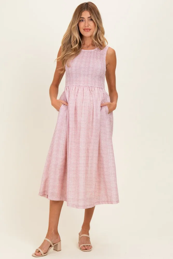 Blush Gingham Sleeveless Smocked Maternity Midi Dress sold by Pinkblush