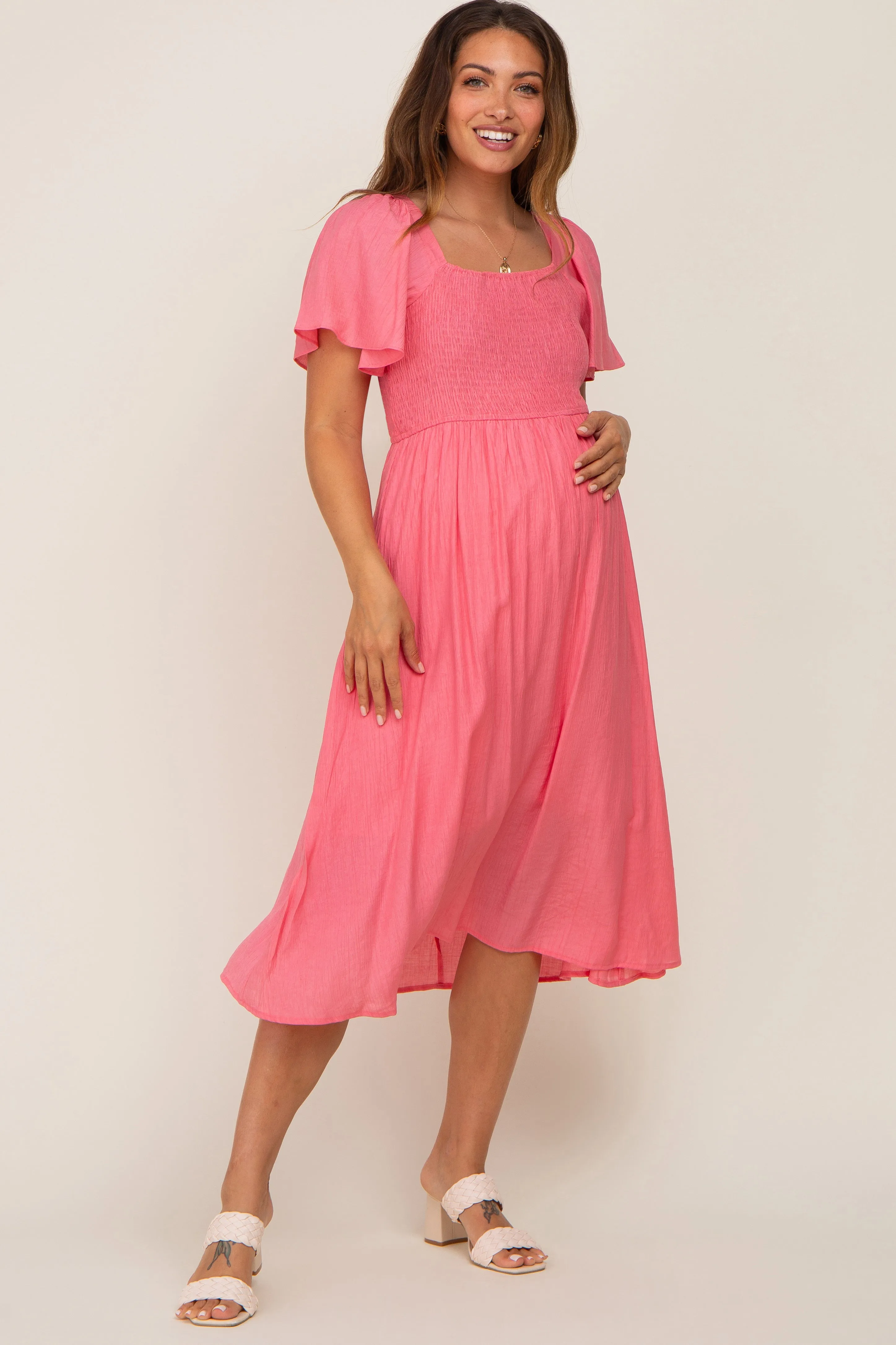Coral Smocked Square Neck Flutter Short Sleeve Maternity Midi Dress sold by Pinkblush