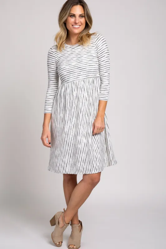 Ivory Ribbed Striped Pleated Midi Dress sold by Pinkblush
