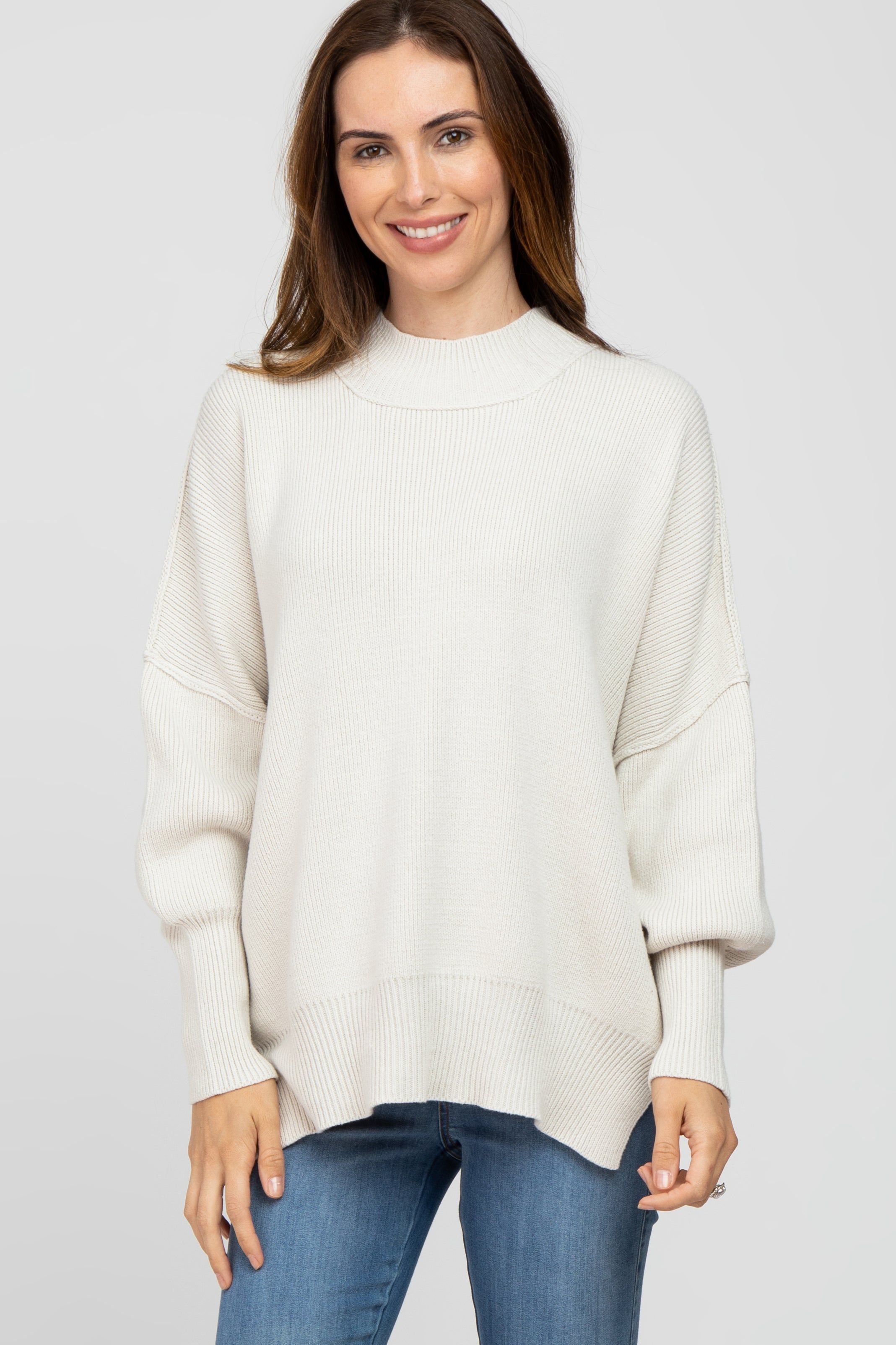 Ivory Mock Neck Exposed Seam Sweater sold by Pinkblush