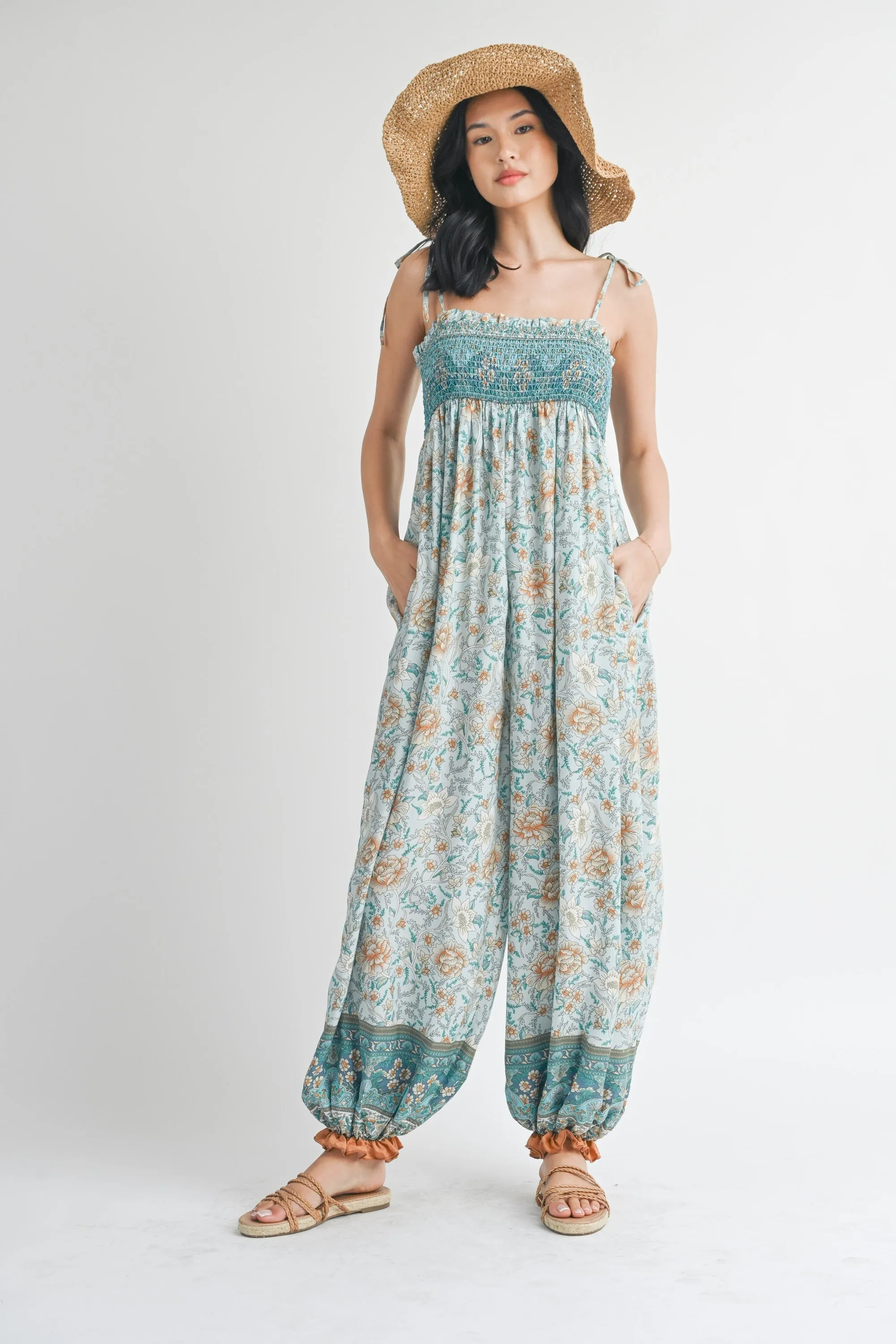 Light Blue Floral Border Print Smocked Shoulder Tie Jumpsuit sold by Pinkblush