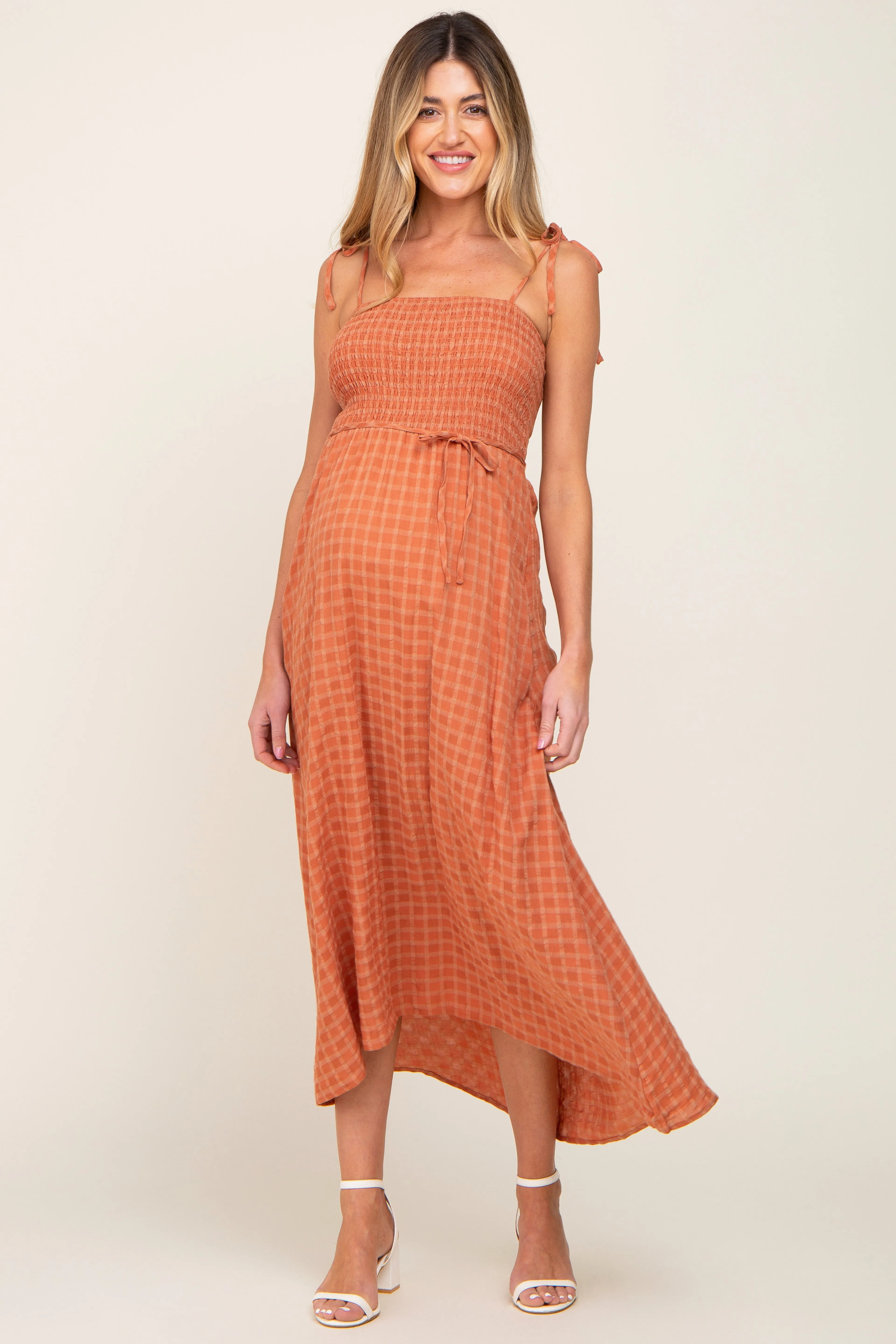 Rust Gingham Smocked Hi-Lo Maternity Maxi Dress sold by Pinkblush