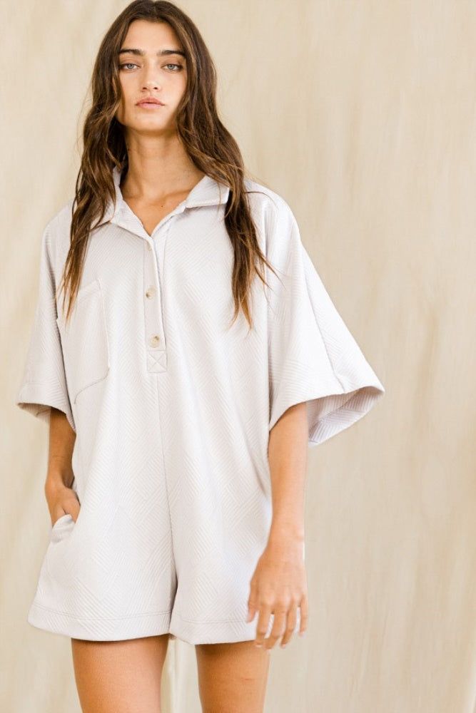 Ivory Solid Textured Oversize Button Up Collared Romper sold by Pinkblush