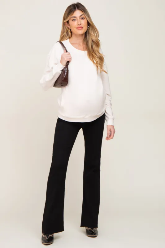 Black Flare Leg Raw Hem Maternity Jeans made by Pinkblush