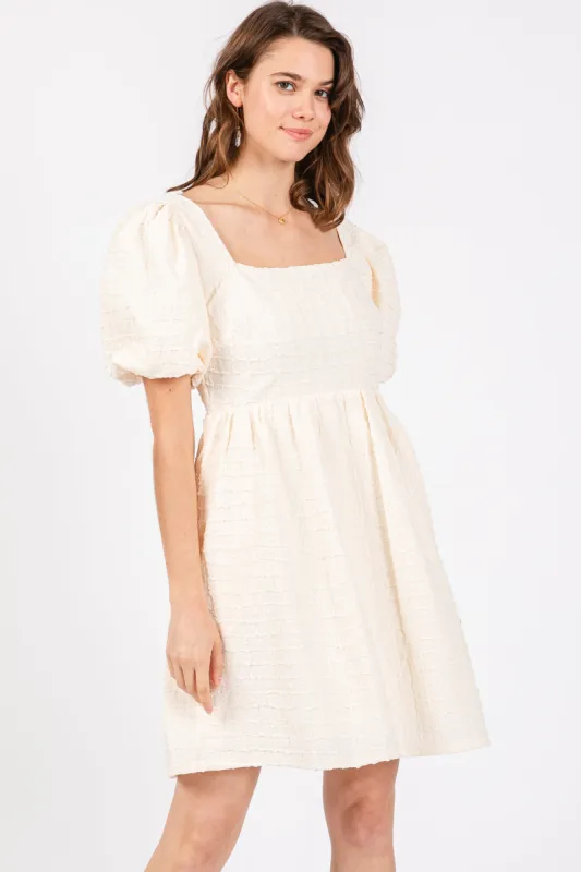 Cream Textured Bubble Sleeve Mini Dress sold by Pinkblush