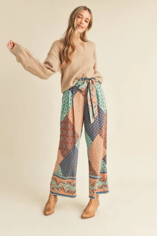 Mauve Border Print Wide Leg Printed Trousers sold by Pinkblush