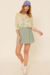 Sage Woven Front Button Wrap Back Pleated Mini Skirt sold by Pinkblush
