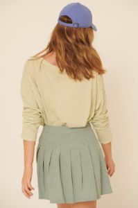 Sage Woven Front Button Wrap Back Pleated Mini Skirt sold by Pinkblush