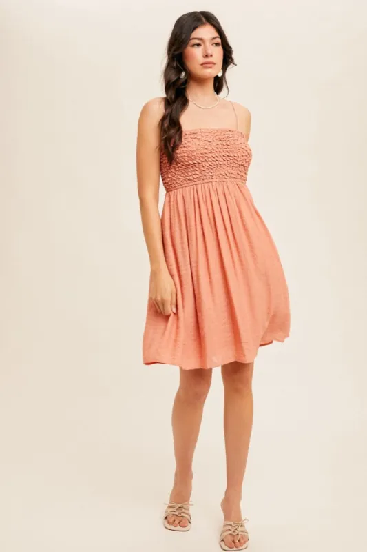 Salmon Textured Smocked Dress sold by Pinkblush