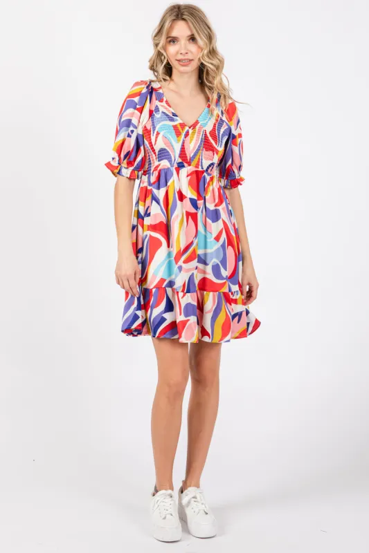 Coral Abstract Print Smocked Dress sold by Pinkblush