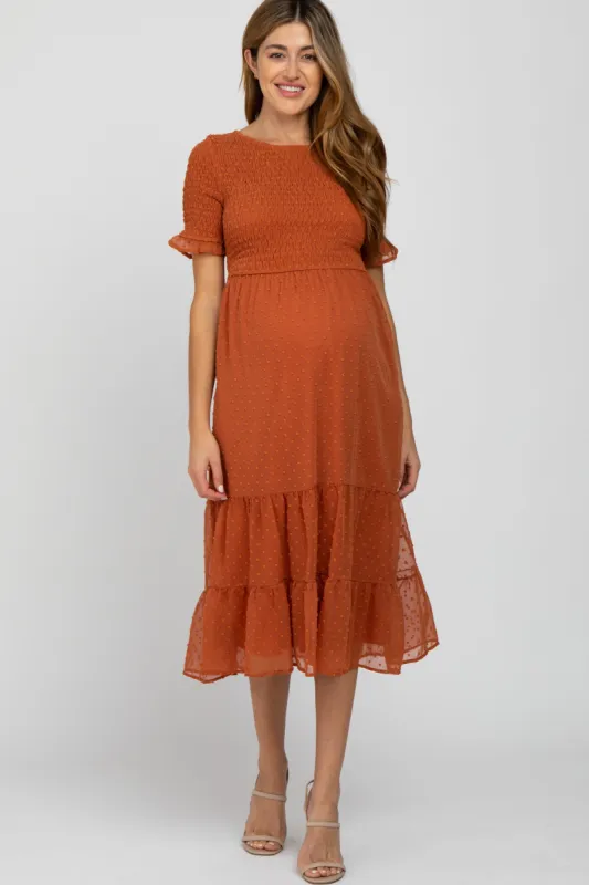 Rust Swiss Dot Smocked Maternity Midi Dress sold by Pinkblush