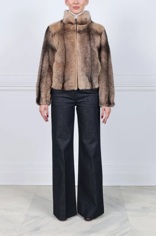 The Luna Camel Cross Mink Bomber Jacket sold by Pologeorgis