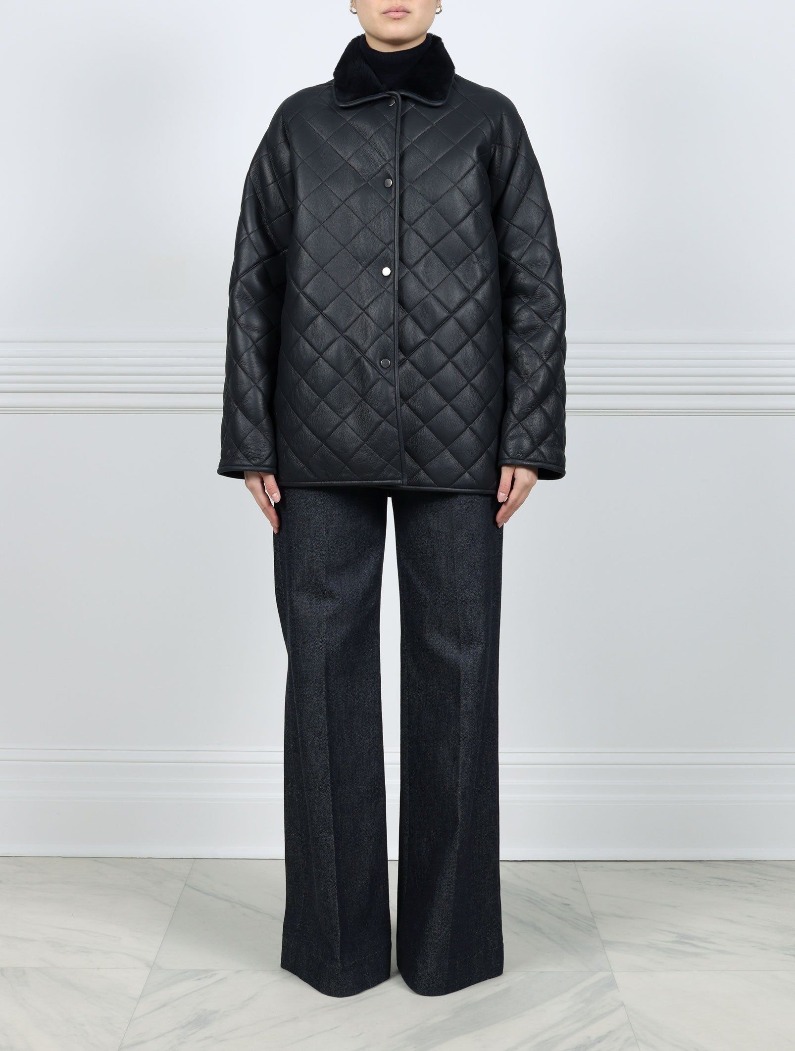 Quilted Shearling Jacket in Navy sold by Pologeorgis