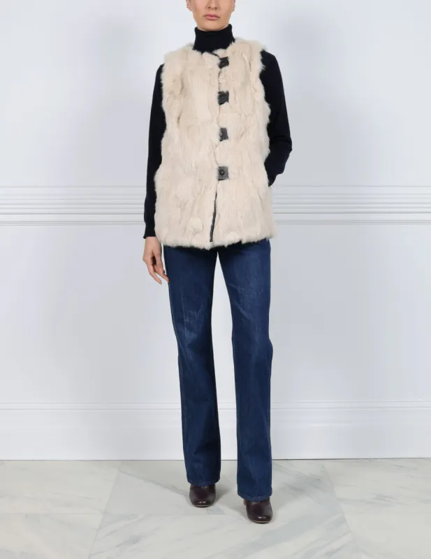 The Lucia Upcycled Fur Vest with Leather Tabs & Piping sold by Pologeorgis